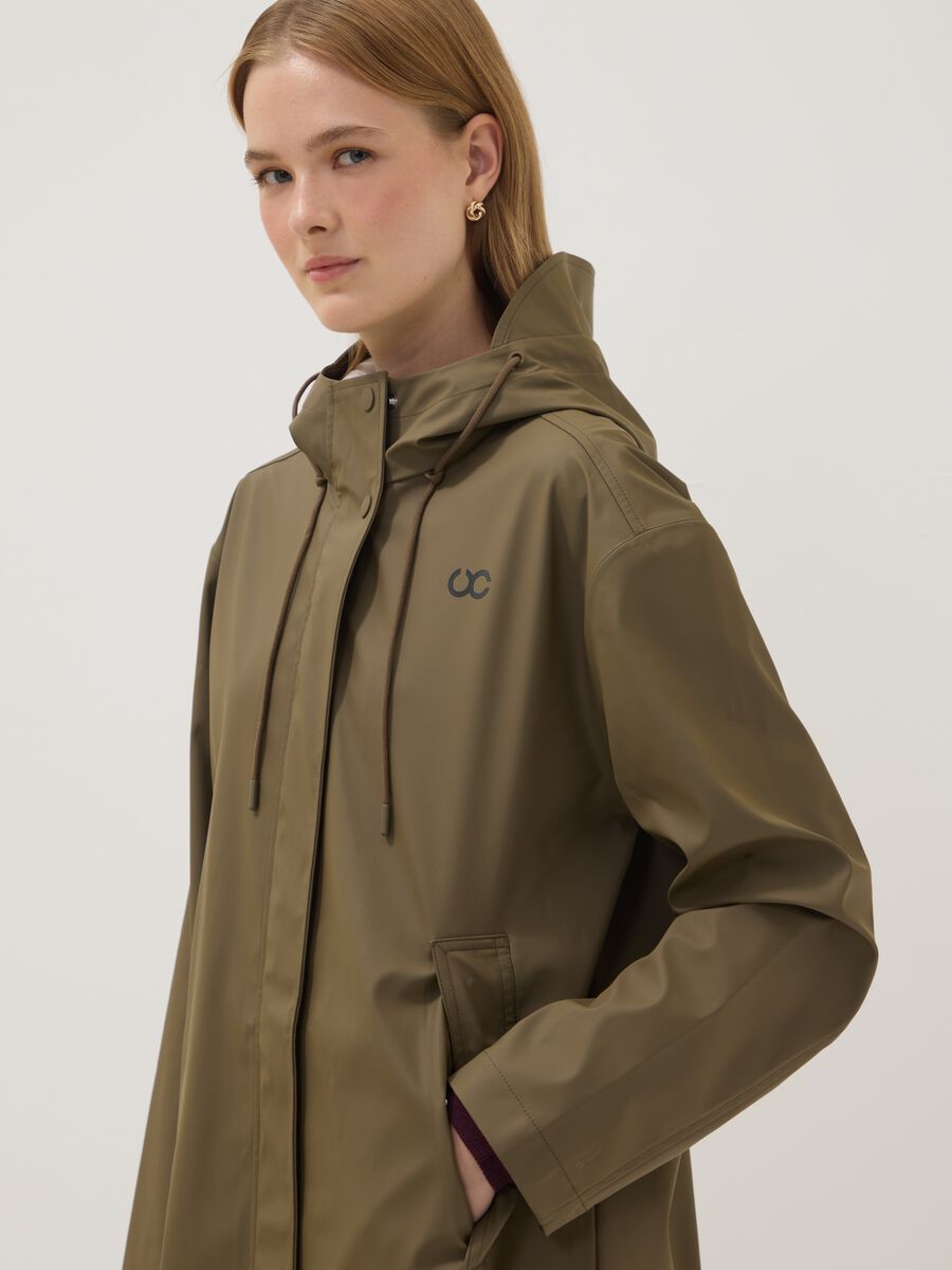 Giacca lunga verde con cappuccio e zip_2