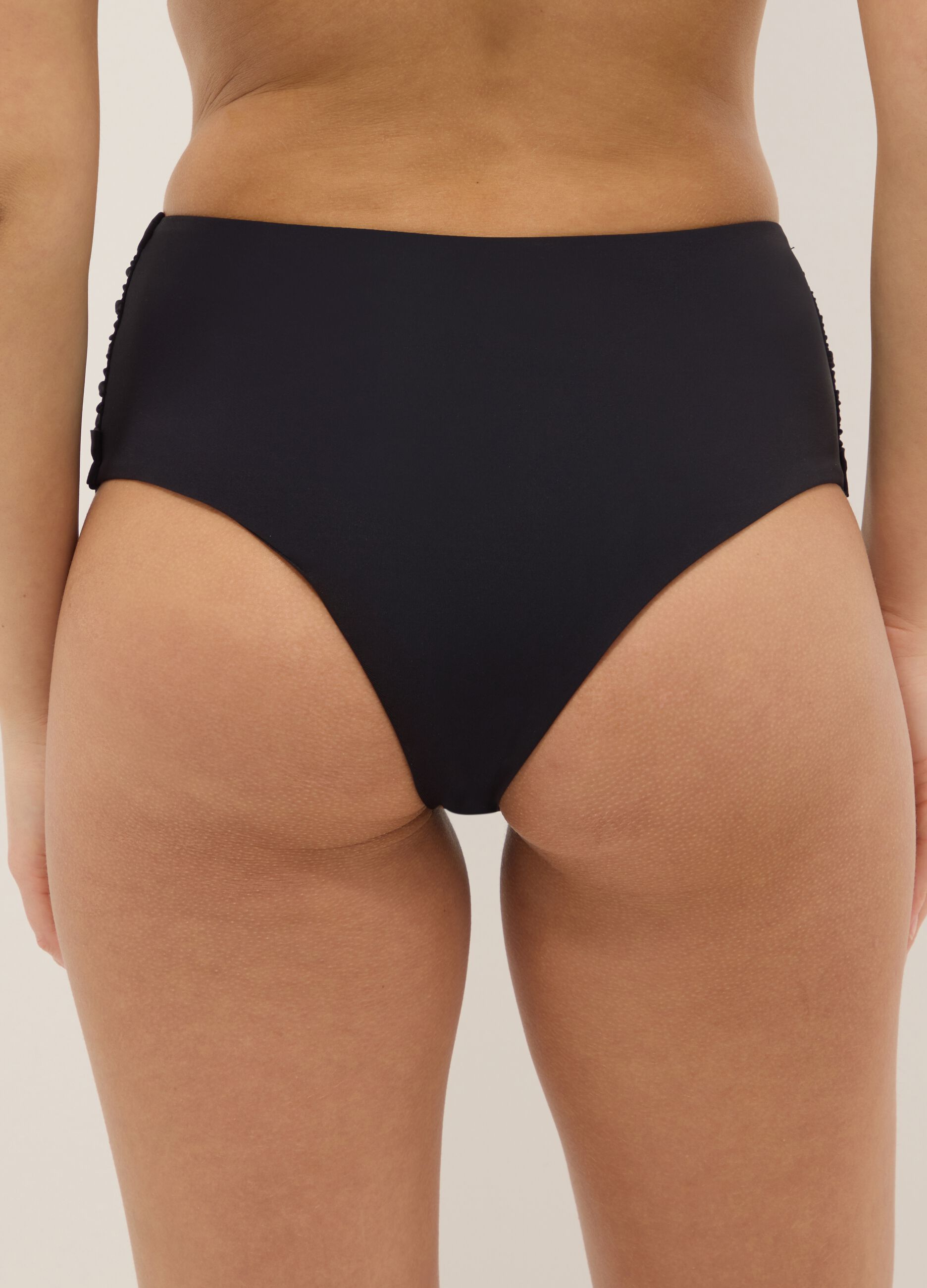 Black bikini bottoms with knotted detail in stretchy shaping fabric