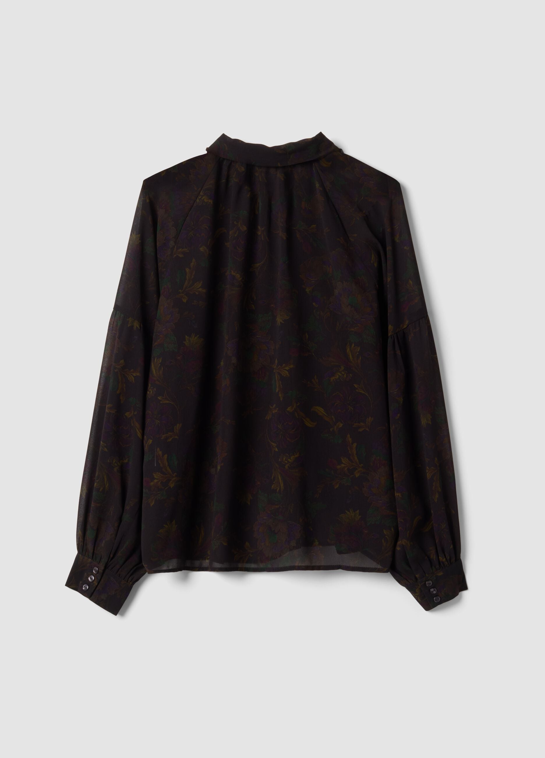 Camicia nera con fantasia floreale e fiocco al collo