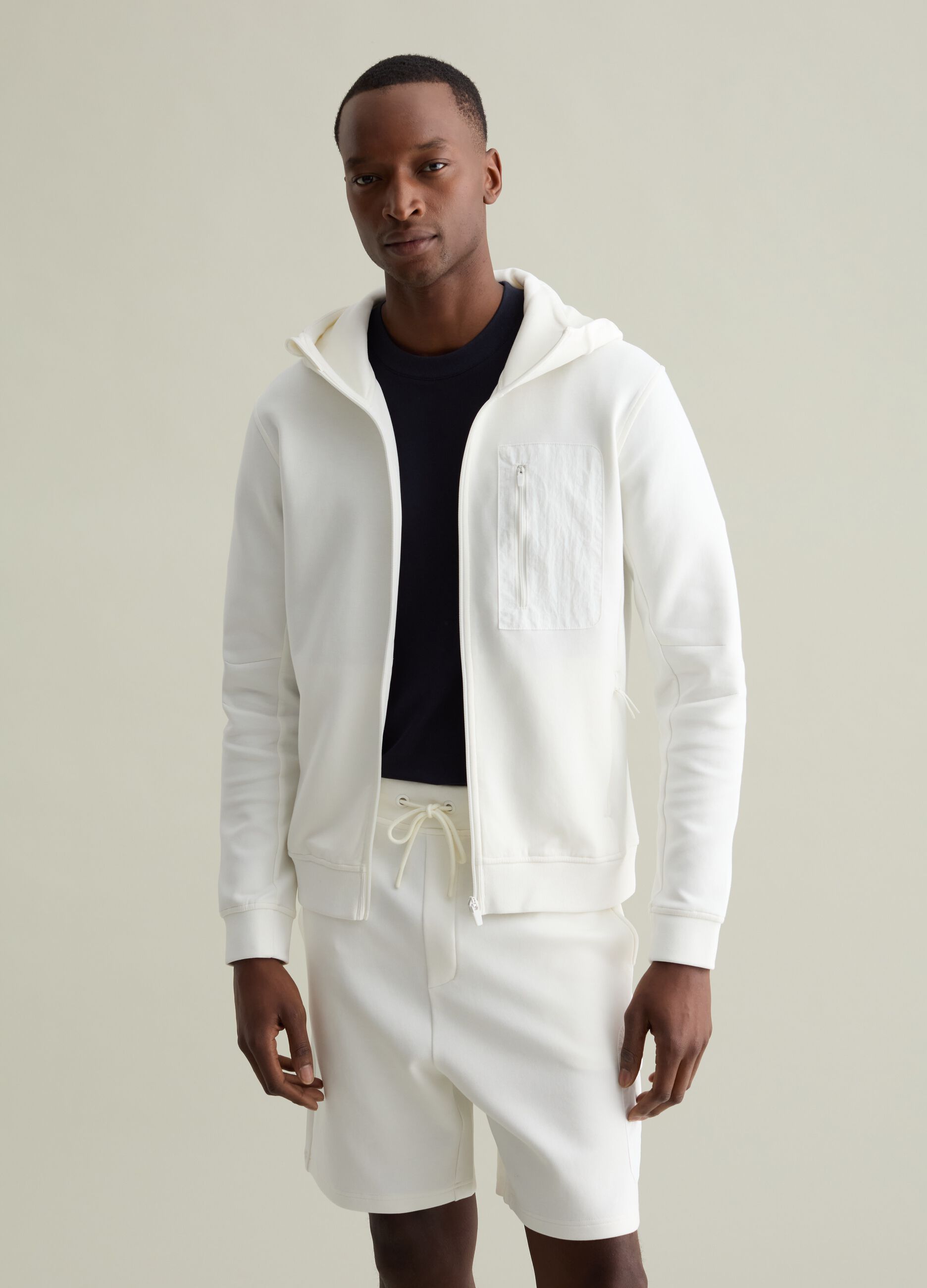 Full-zip in tessuto tecnico con cappuccio