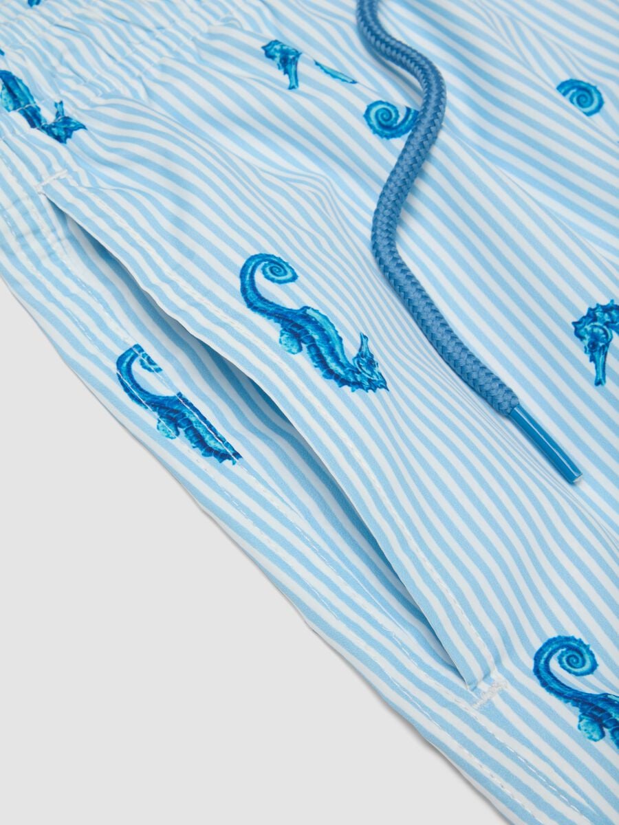 Blue striped swim shorts with seahorse print_5