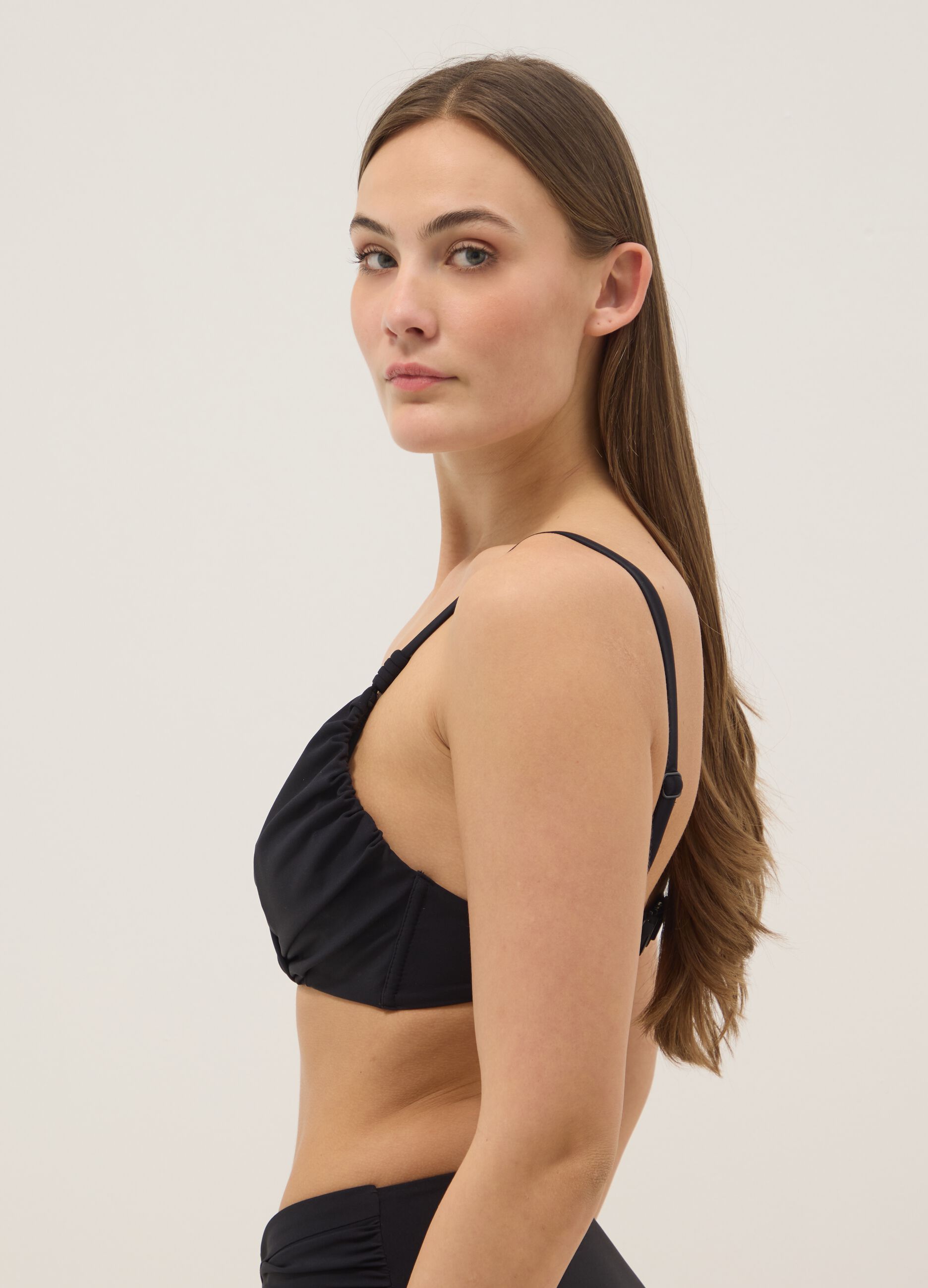 Black bikini top in stretch fabric with shaping effect