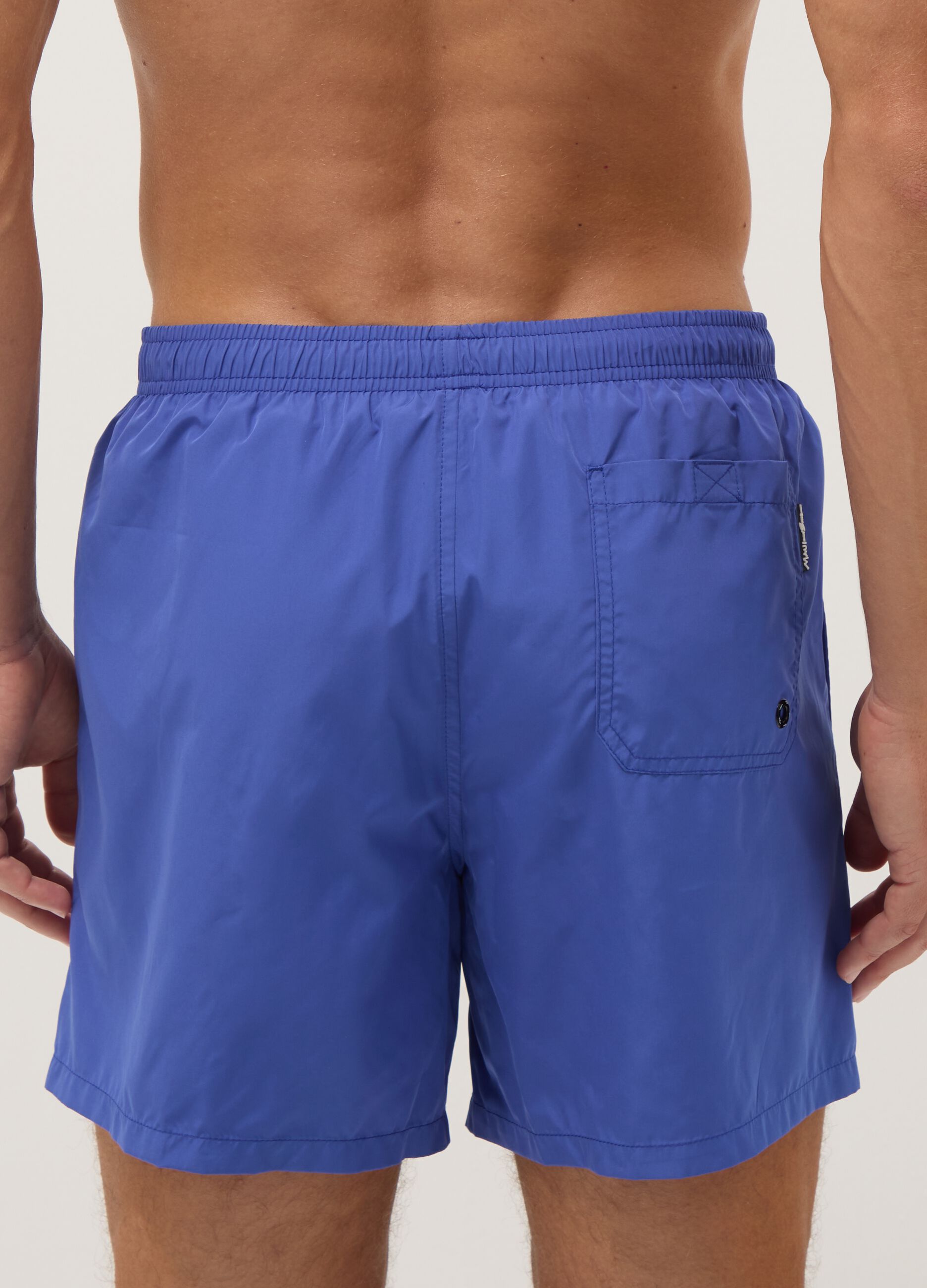 Blue swim shorts with elasticated waistband and drawstring