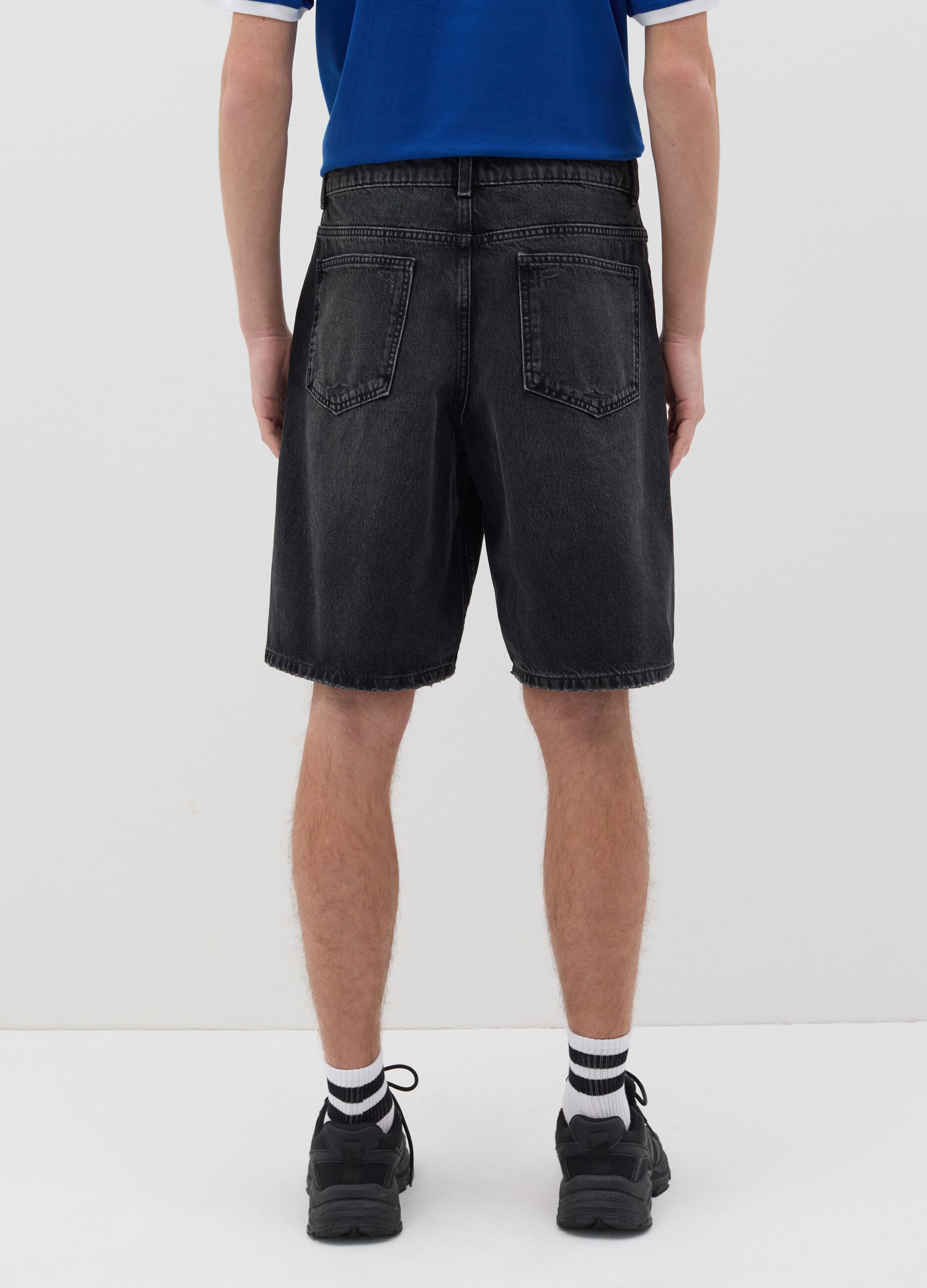 Black denim shorts with ripped details