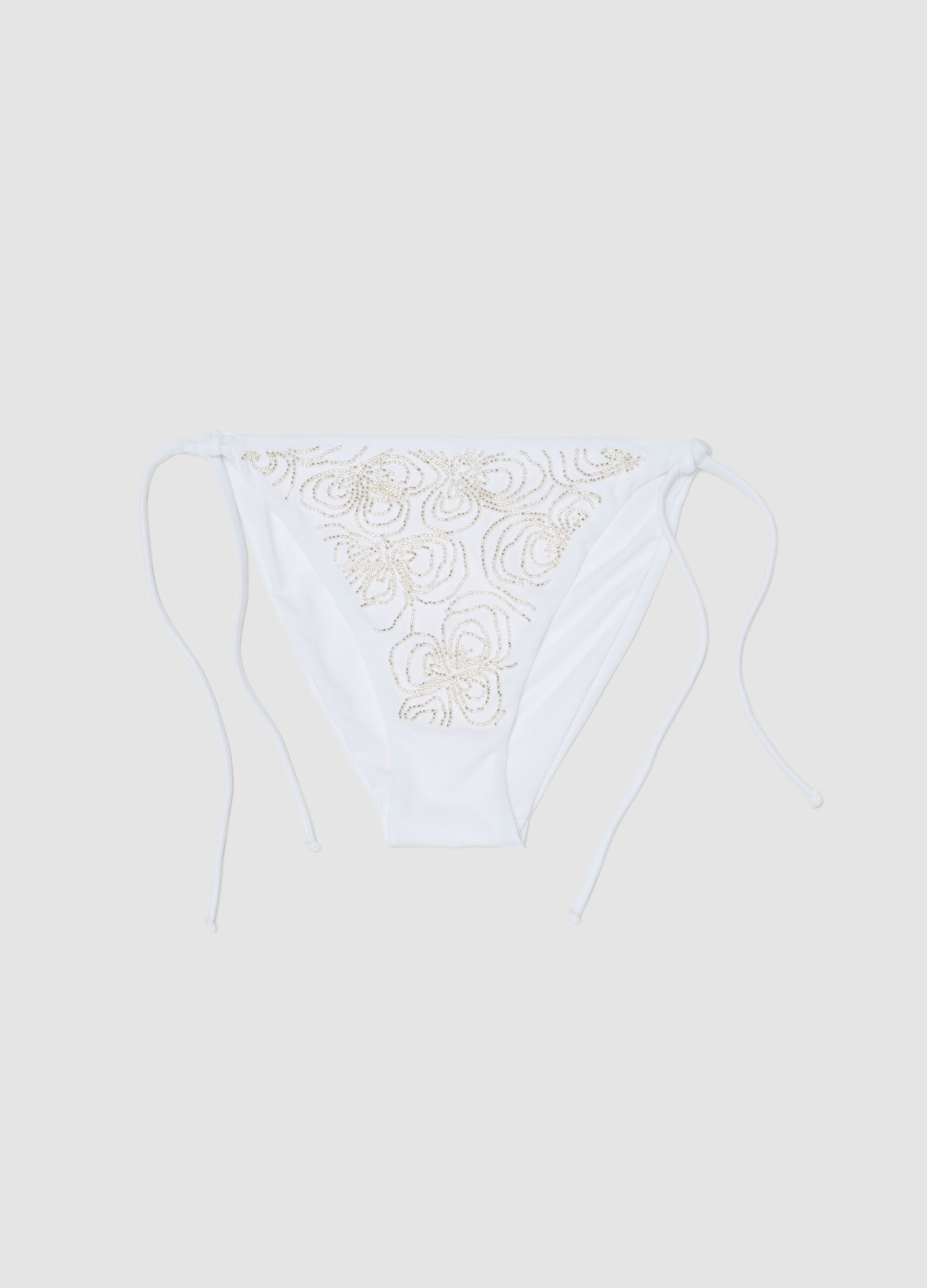 White stretch bikini bottoms with decorative beads