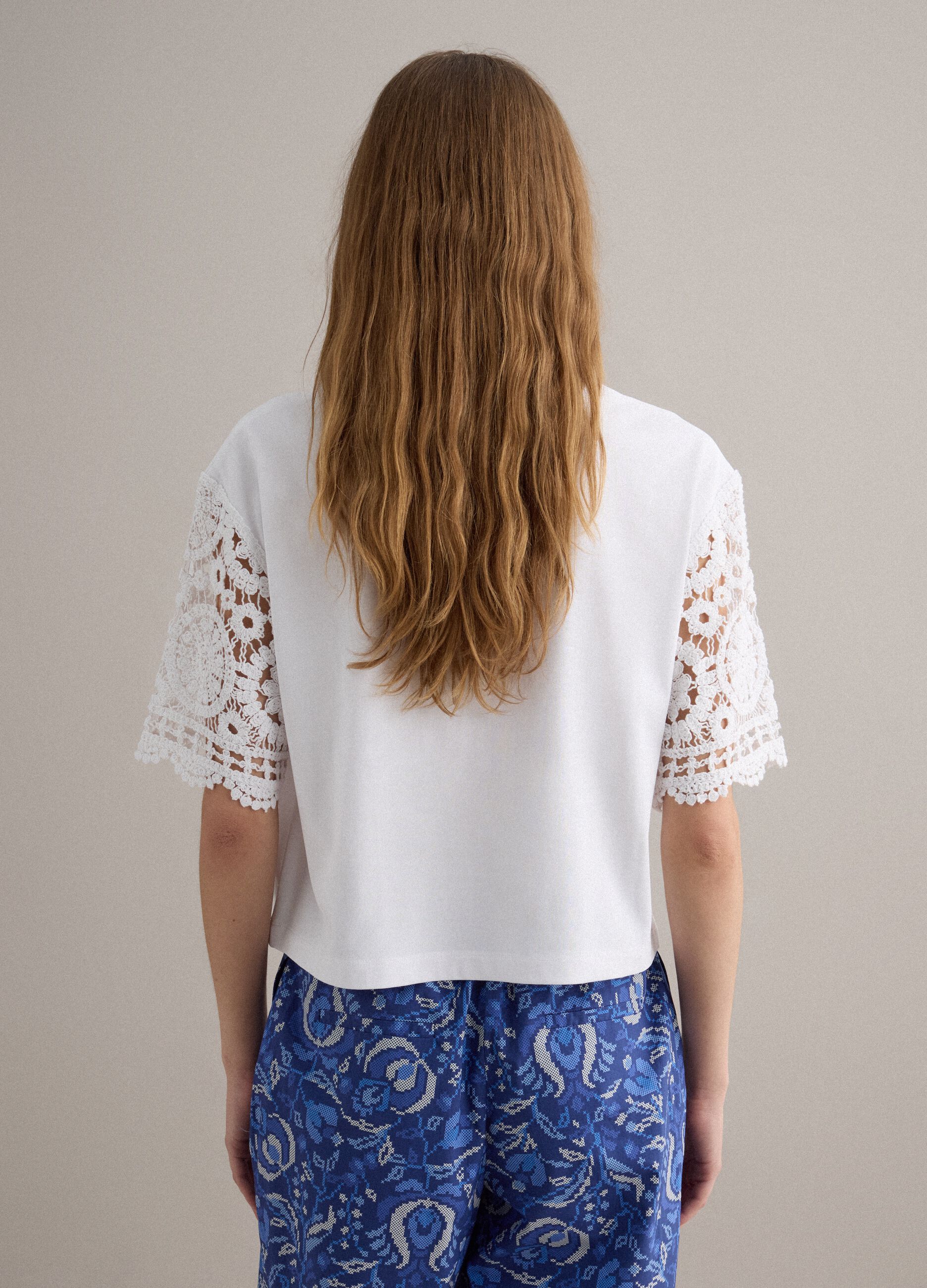 White short-sleeve cotton-blend T-shirt with mesh details