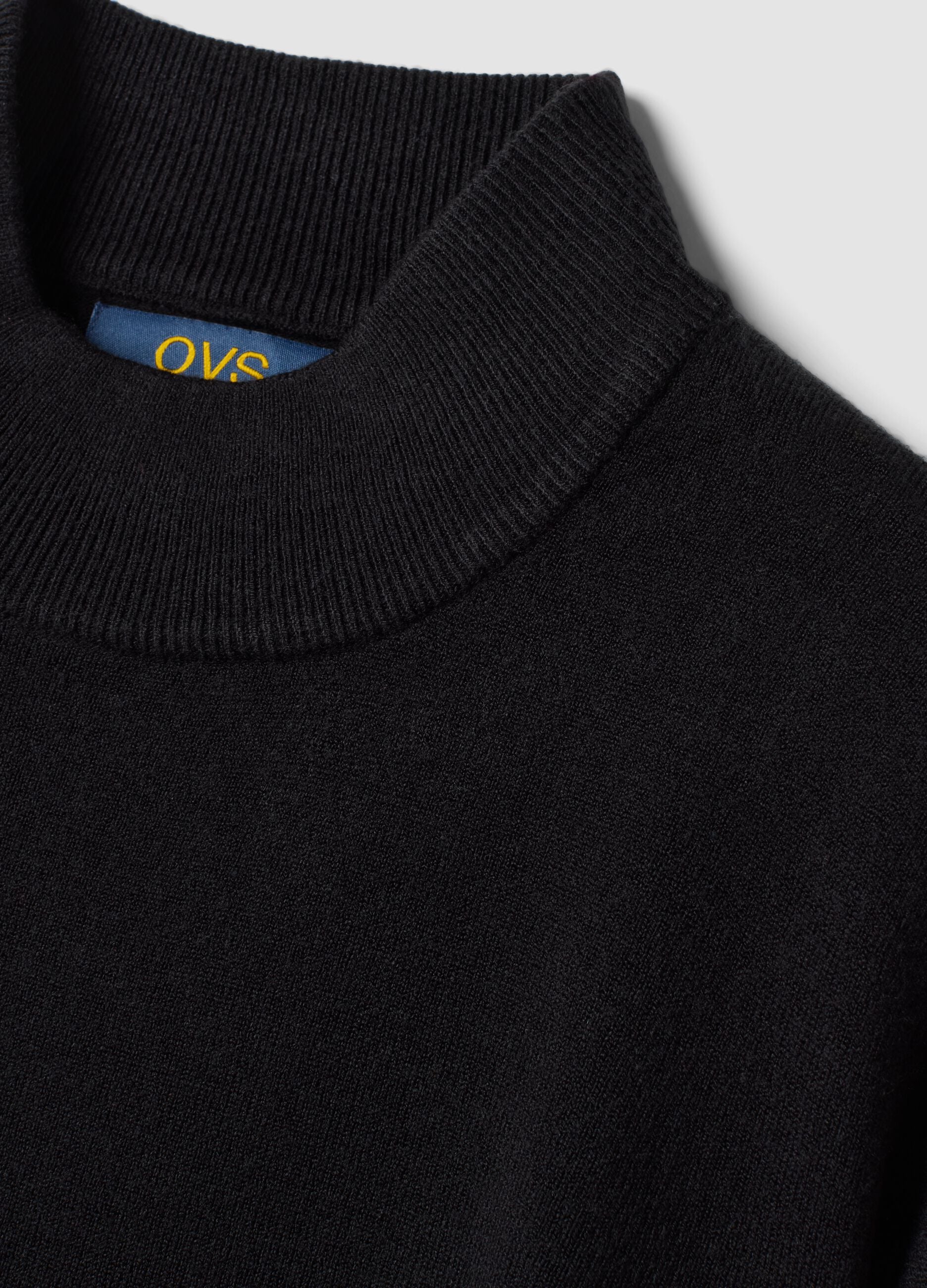 Black long-sleeve top with raised neckline, regular fit