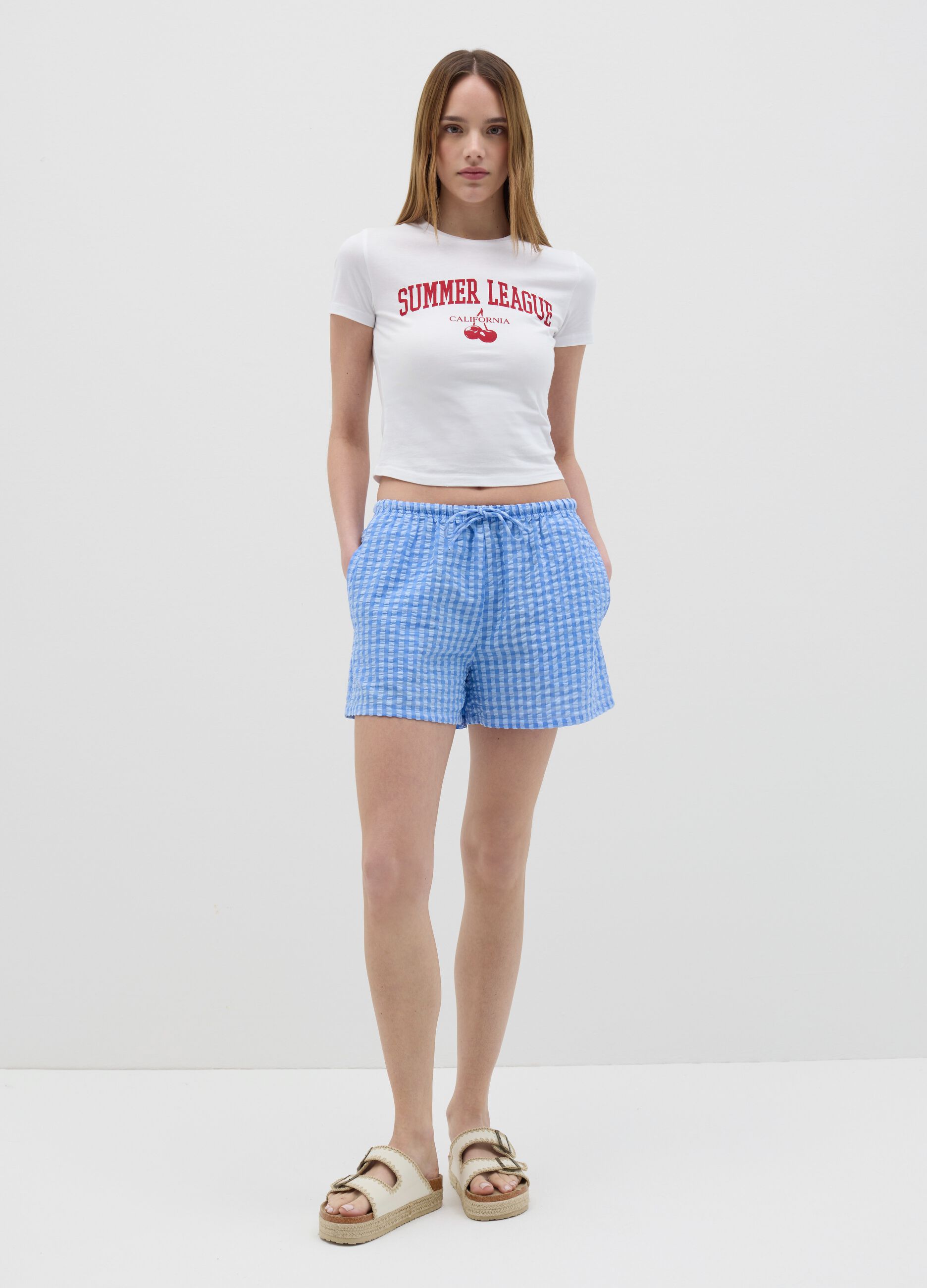 Light blue shorts in striped cotton
