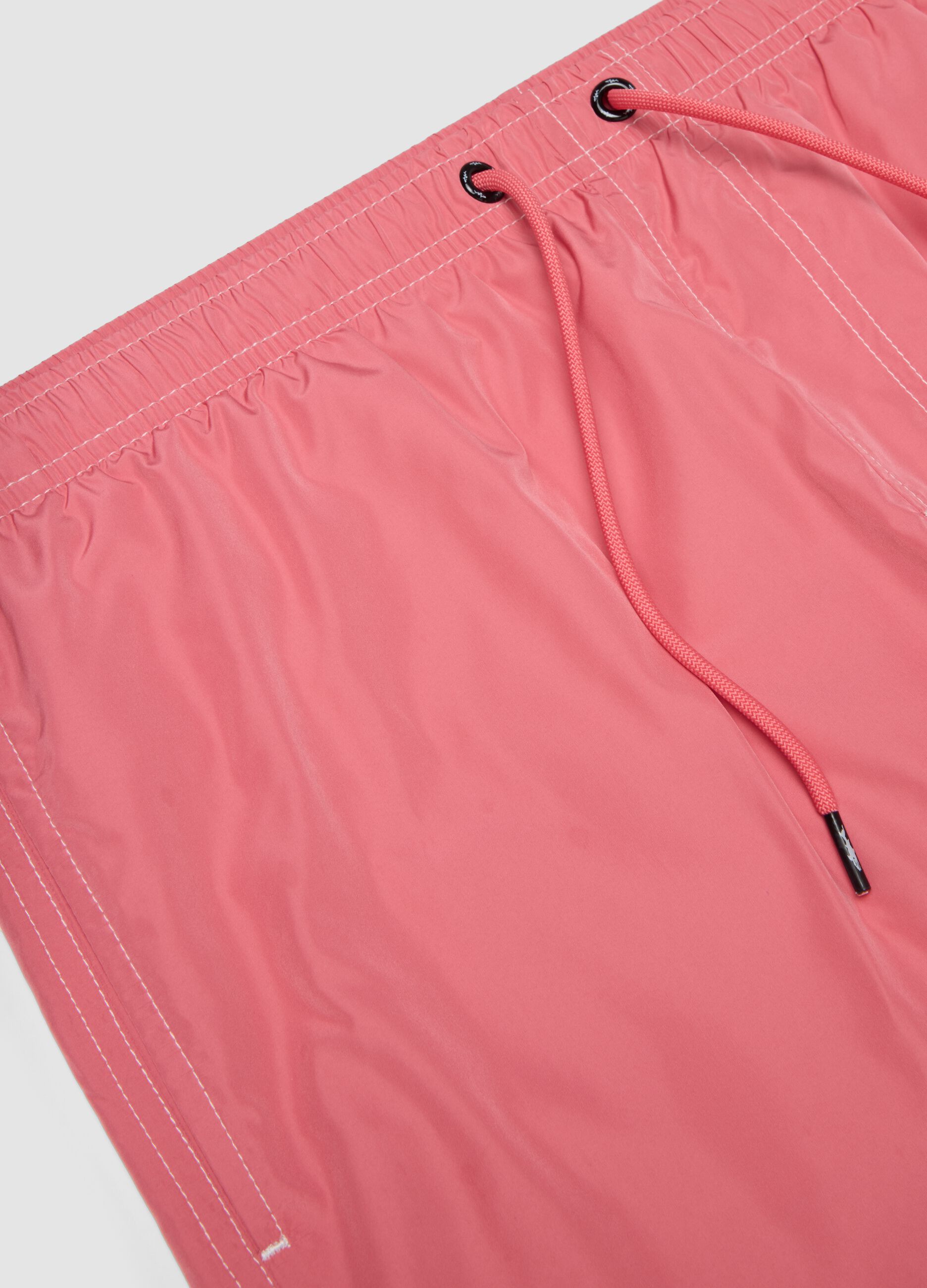 Pink swim shorts with elasticated waist