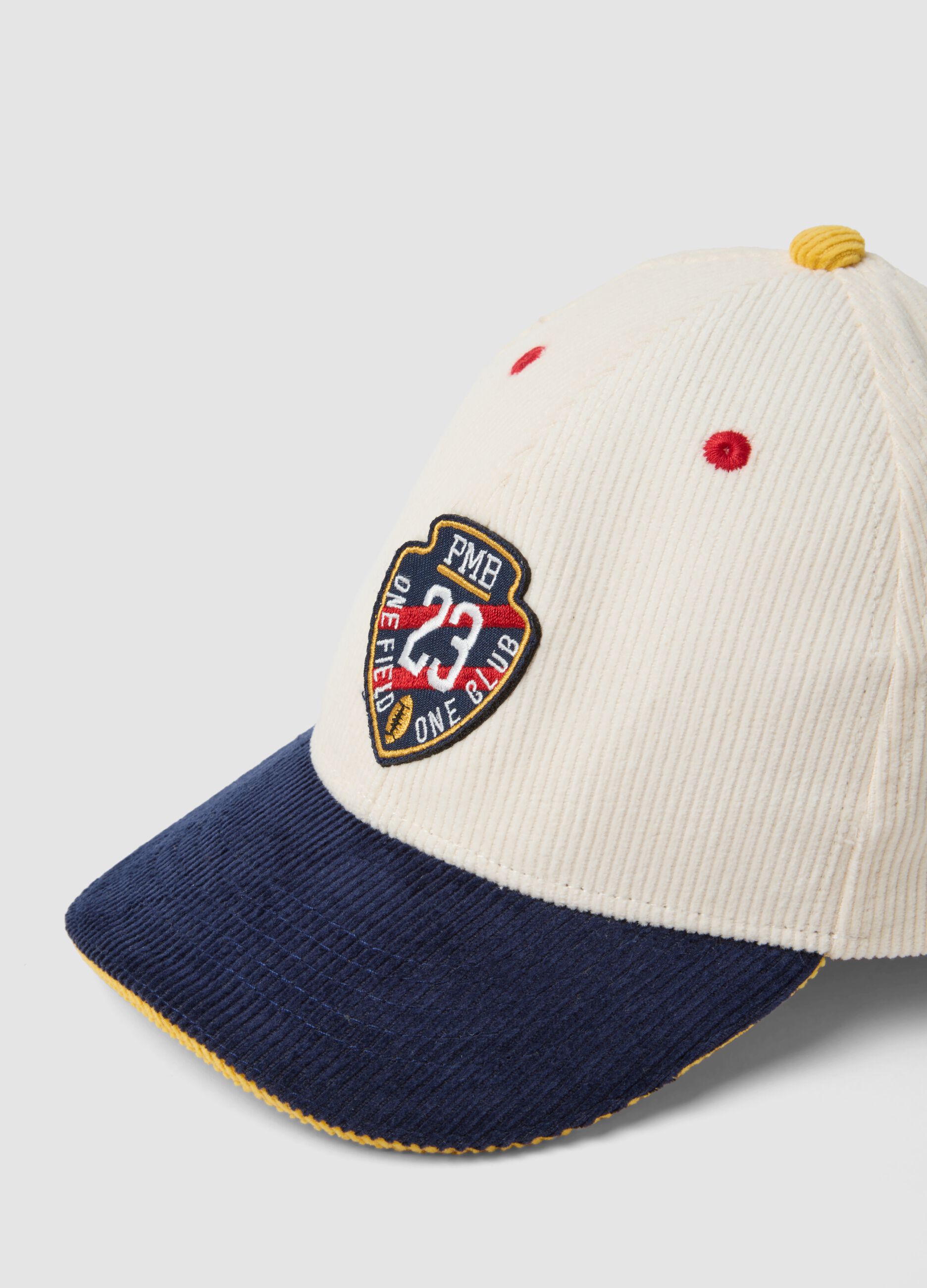 Beige pure cotton cap with blue peak and patch