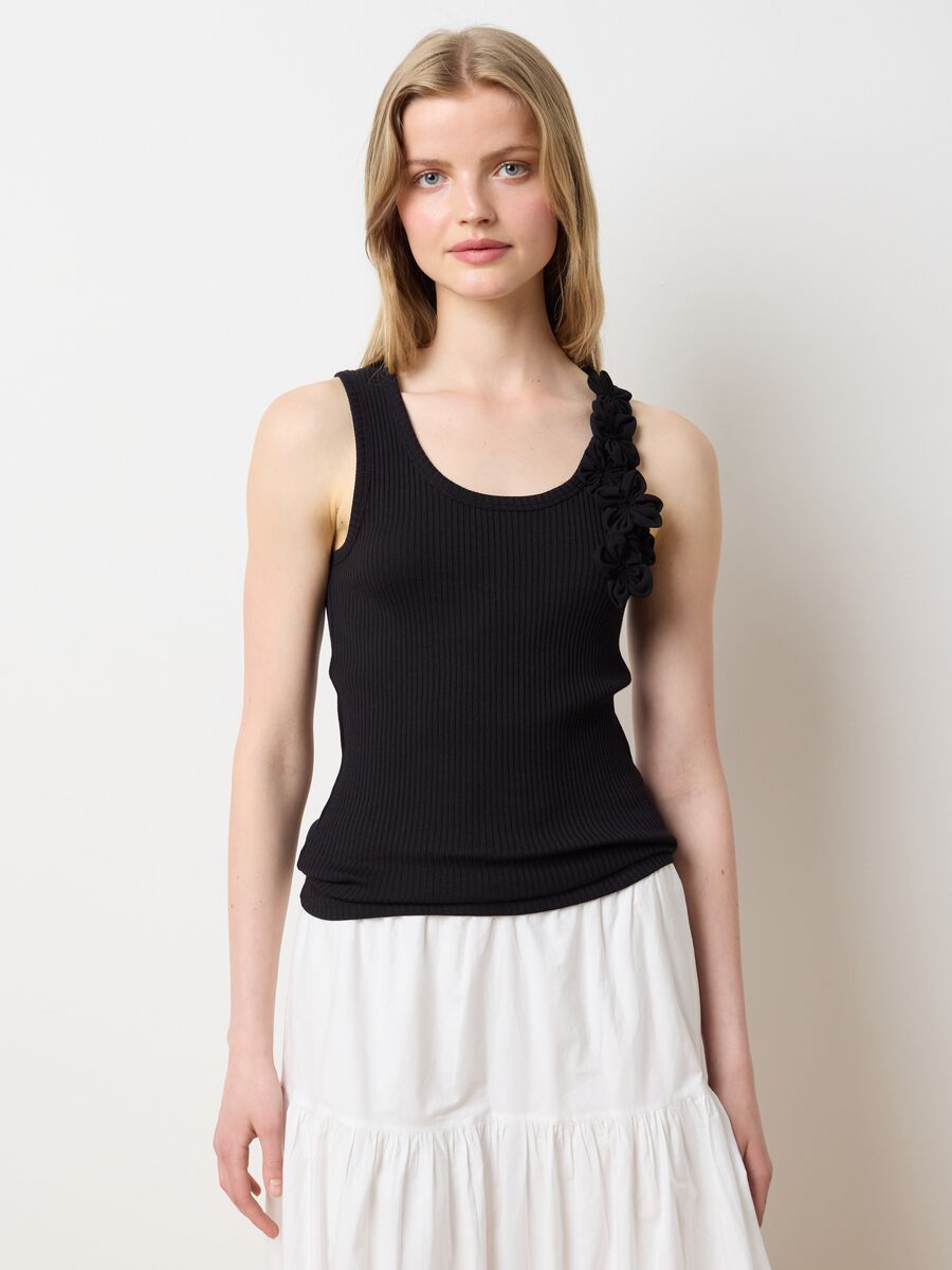 Black ribbed top with floral applications_0