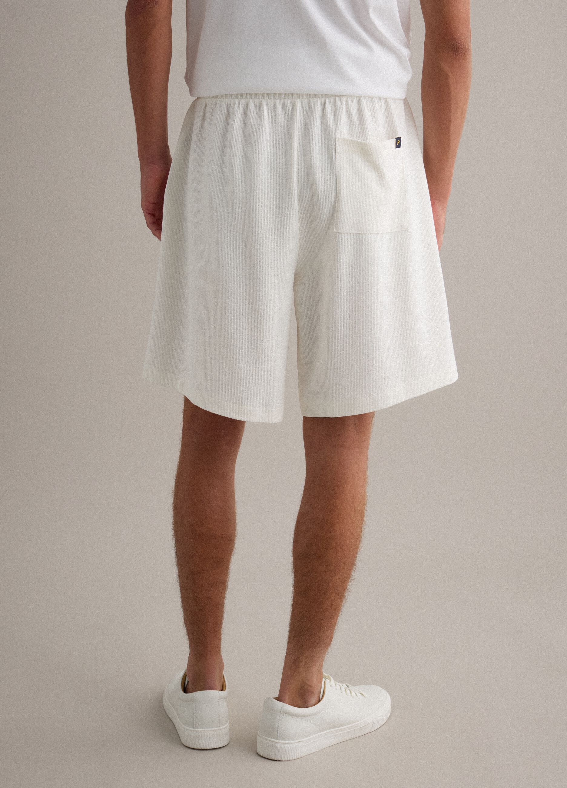 White cotton-blend jogger shorts with drawstring, relaxed fit