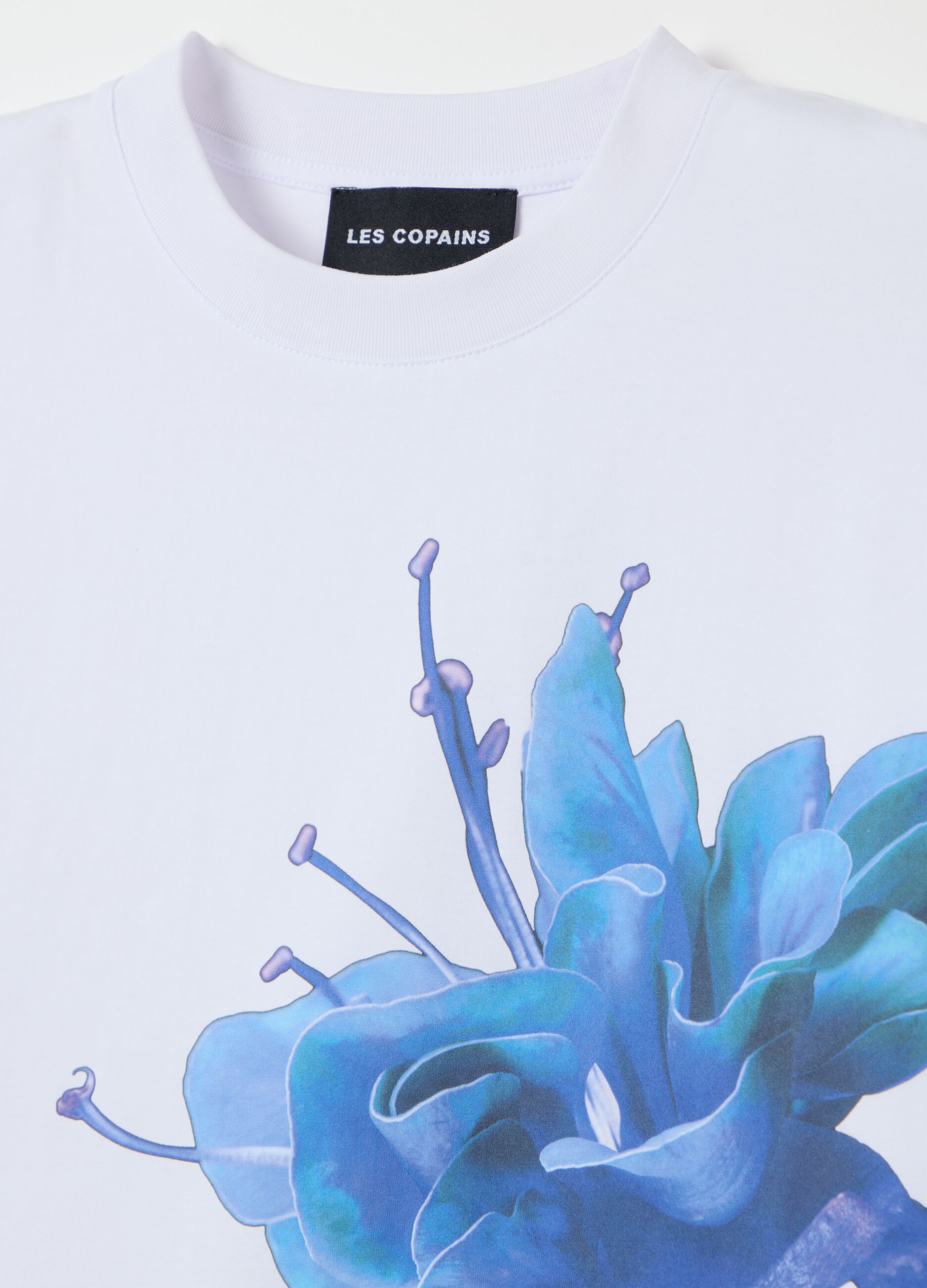 White cotton crew neck T-shirt with blue flower