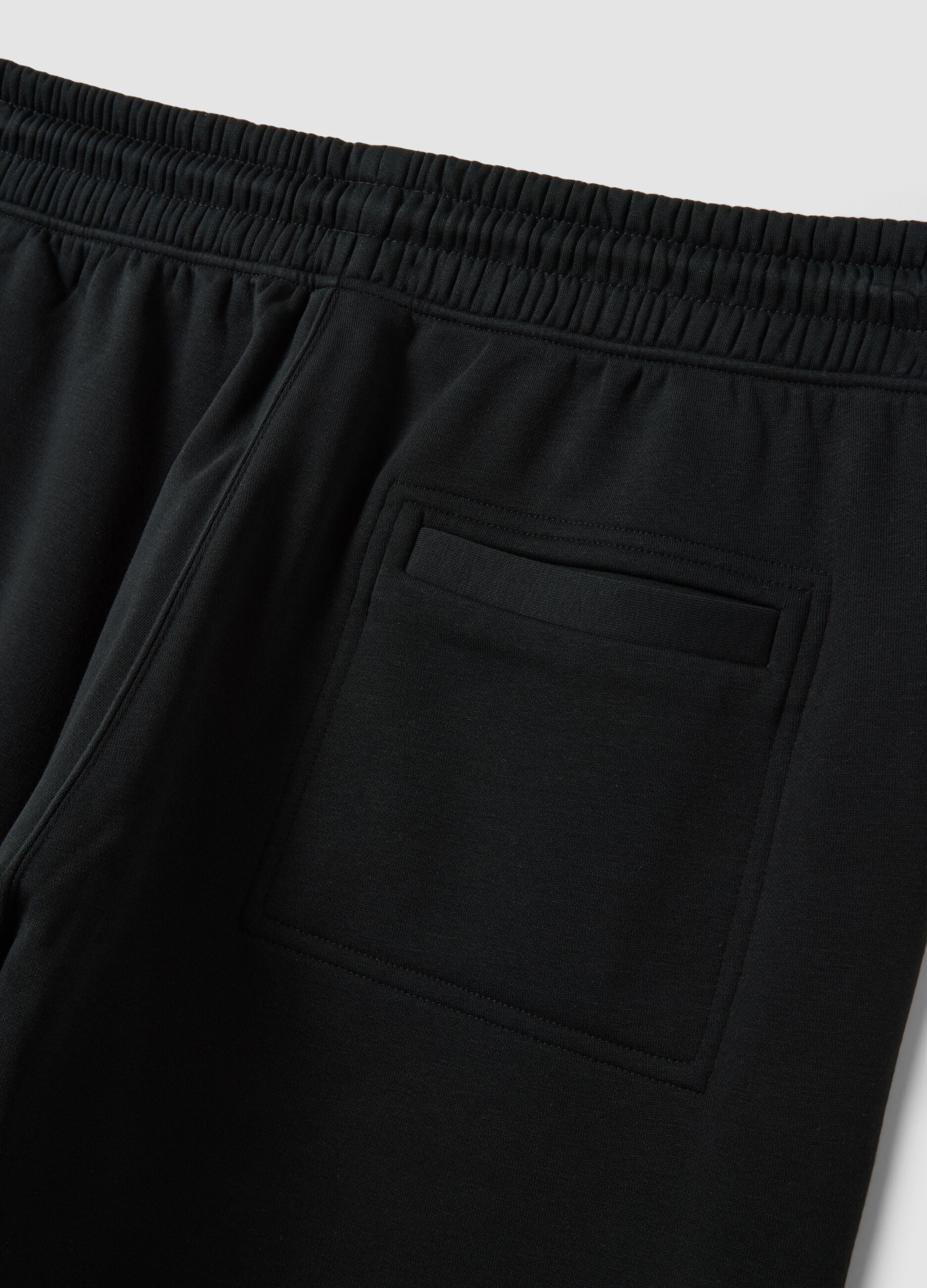 Jogger neri in misto cotone con fondo a polsino e coulisse