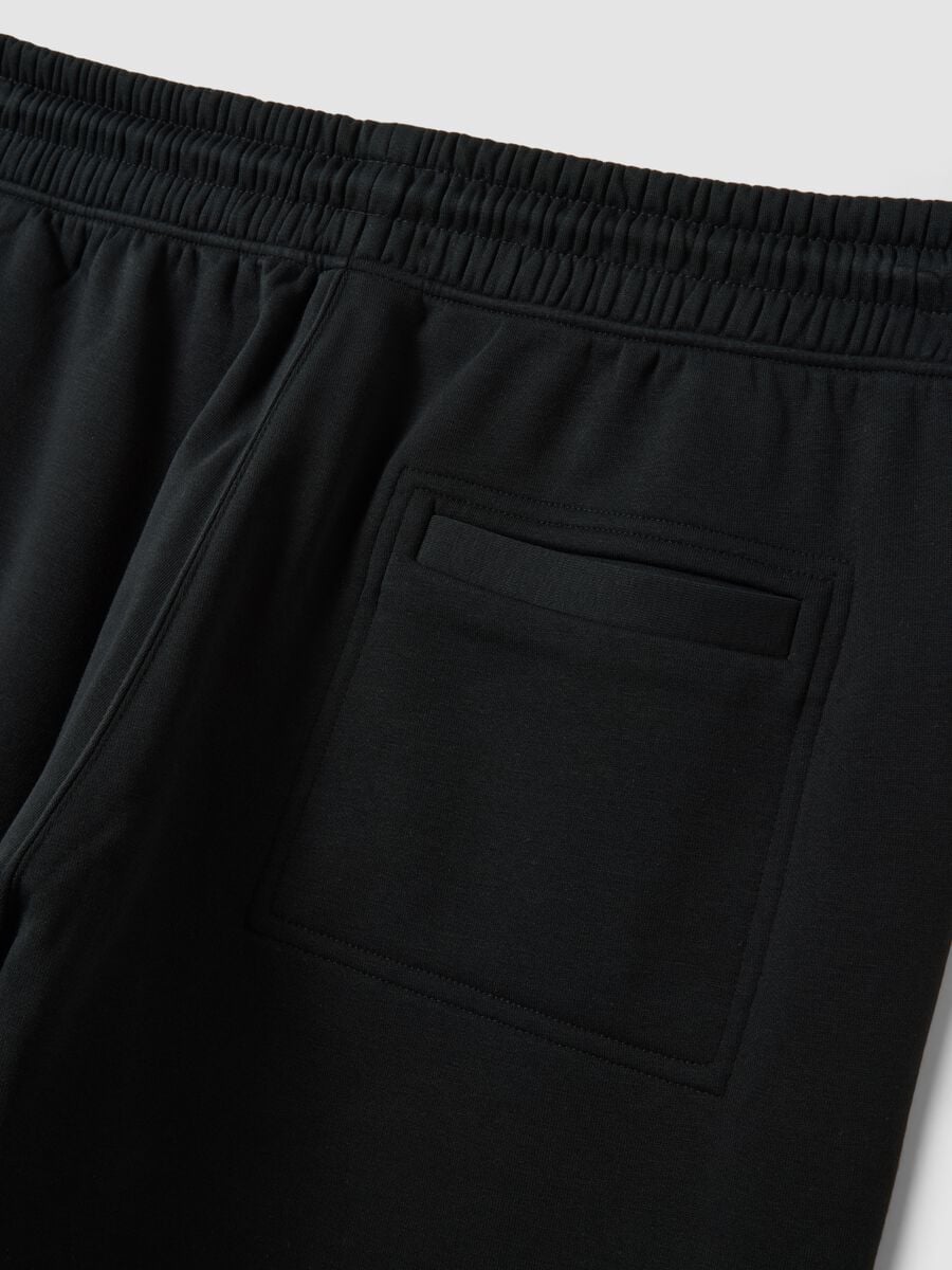 Black cotton-blend joggers with cuffed hems and drawstring waist_6