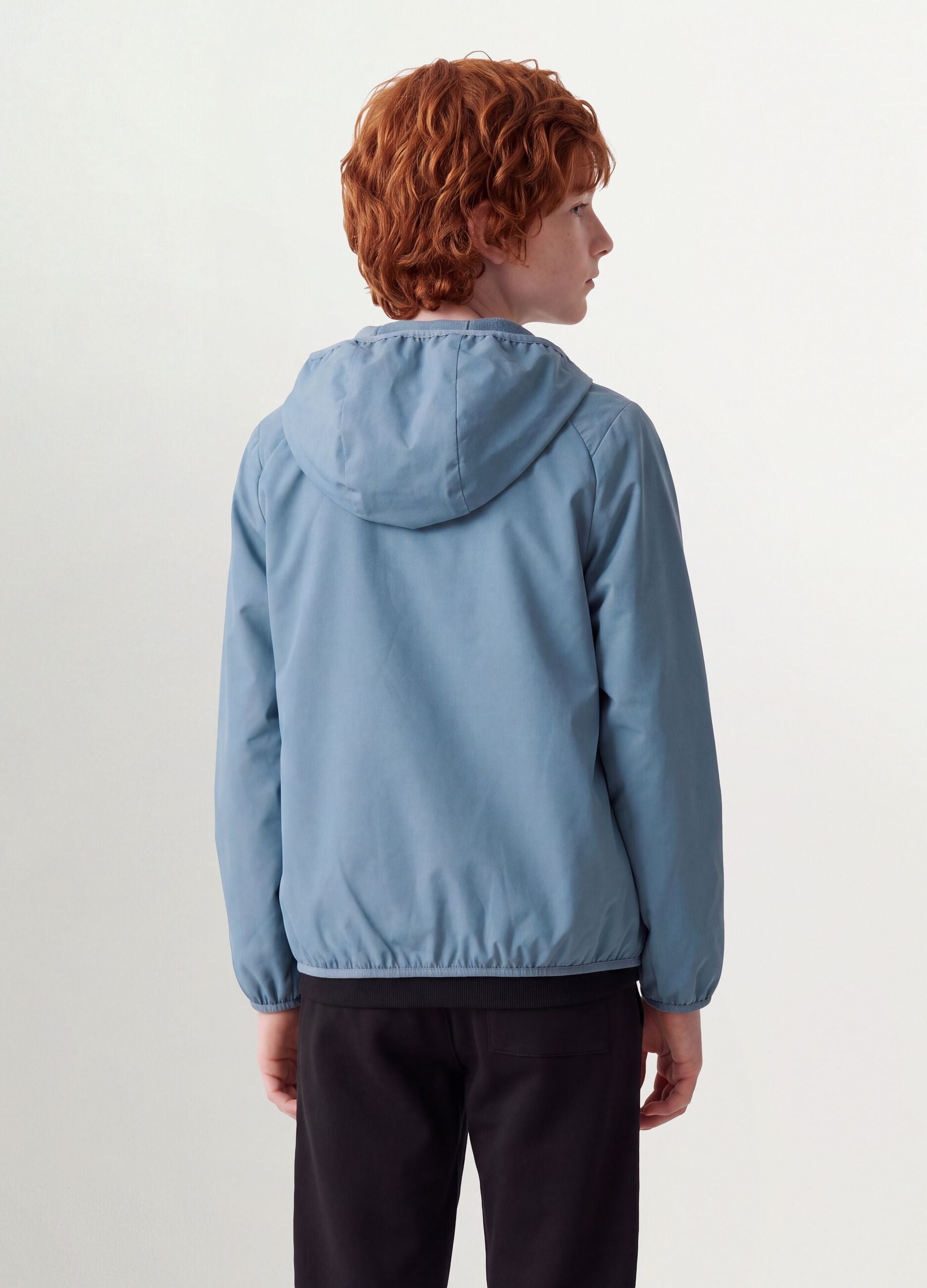 Blue oversized rain jacket with hood and zip for boys