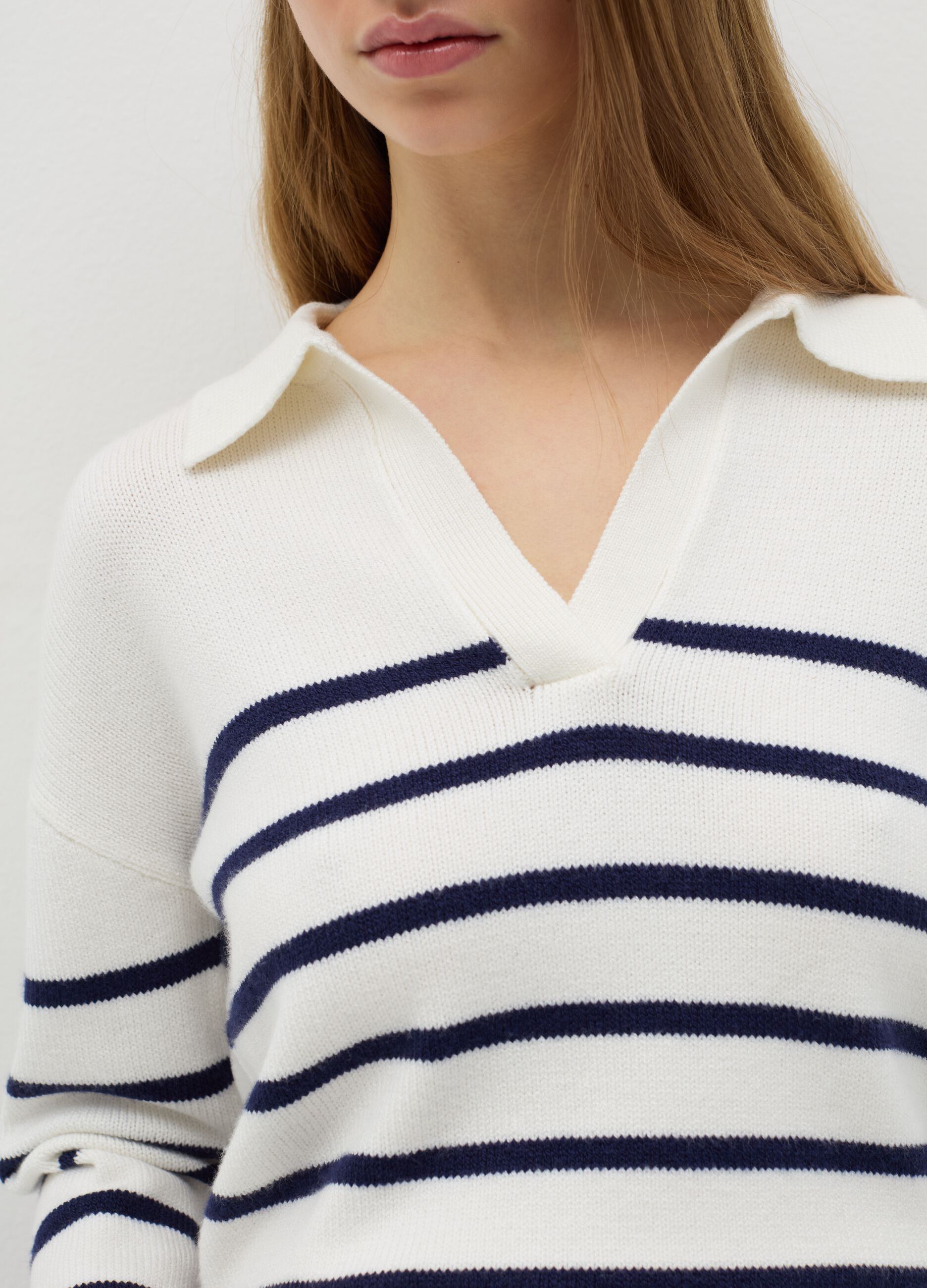 Top with blue and white stripes and polo neck