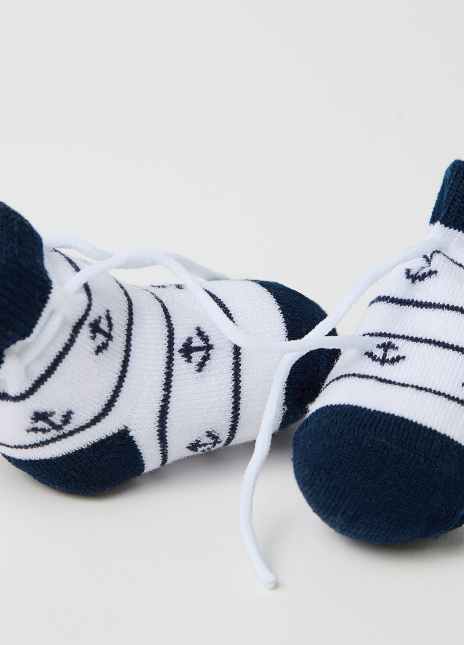 White and blue knit shoes with anchors embroidery