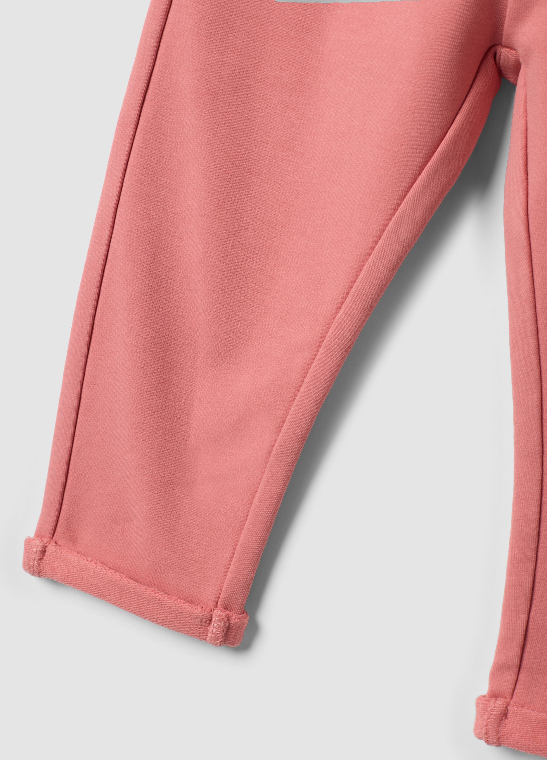 Pink stretch cotton joggers with turn-up hem for baby girl