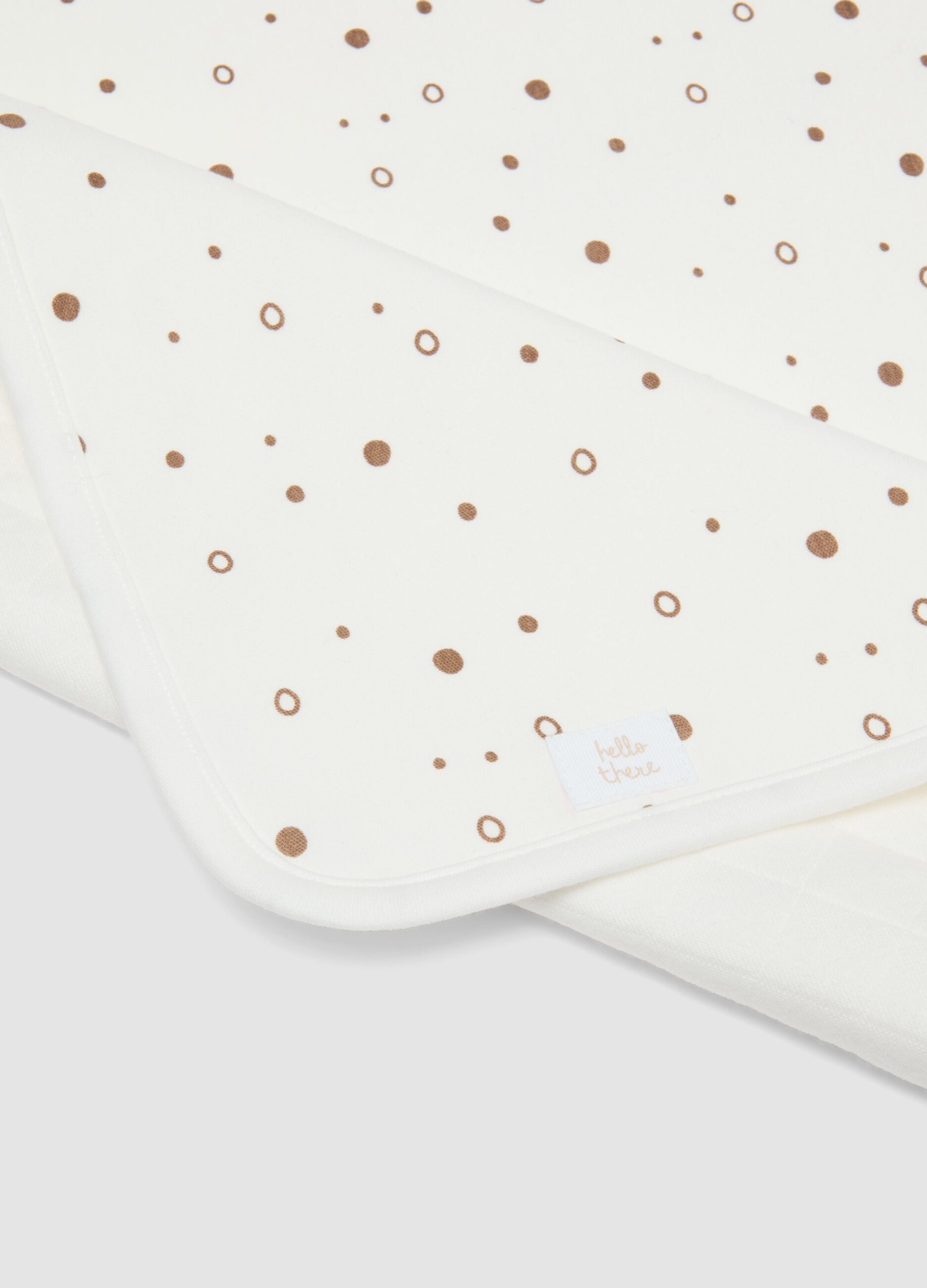 White organic cotton blend baby blanket with polka dots