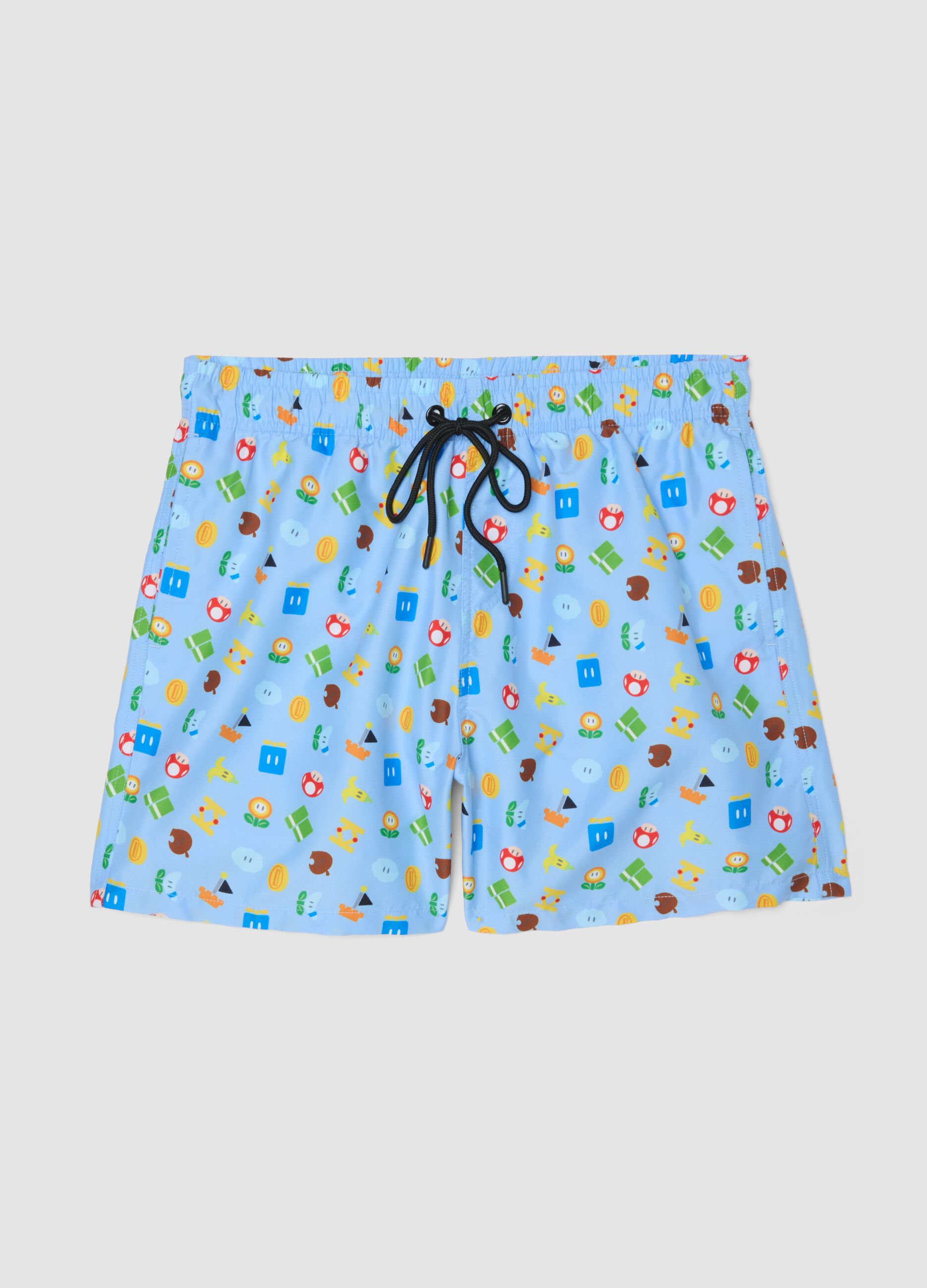 Blue swim shorts with Super Mario prints