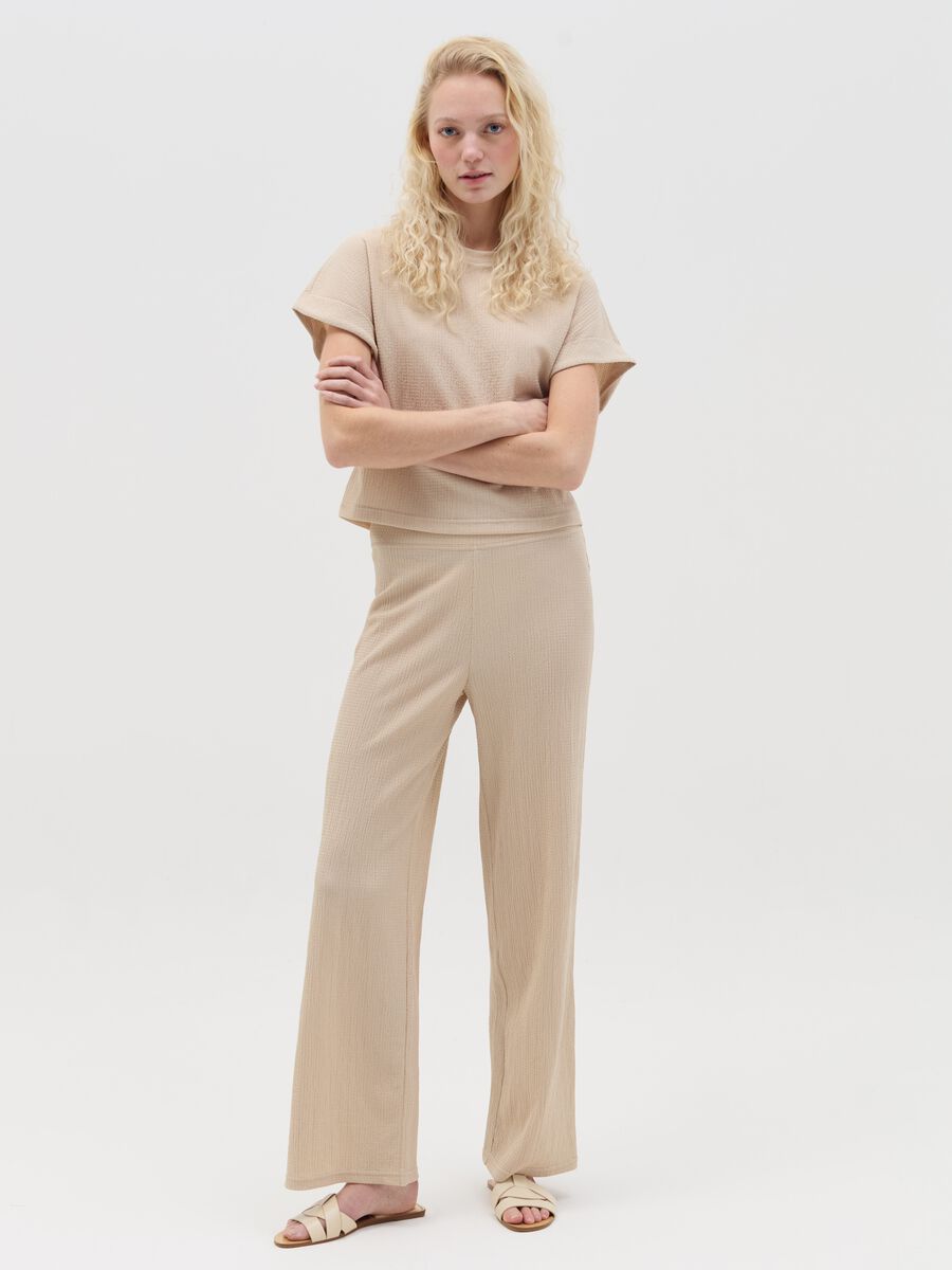 Wide-leg beige trousers with waffle weave_0