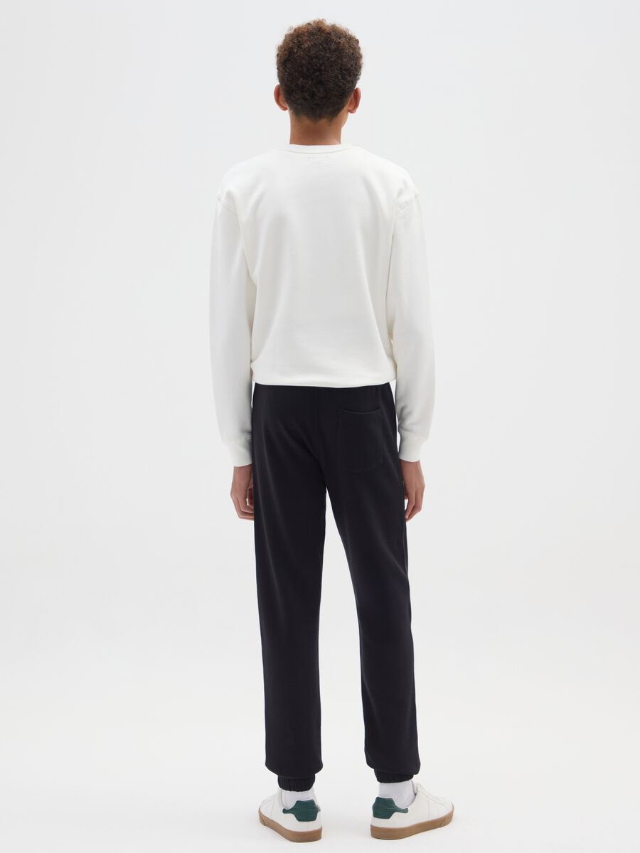 Pantaloni jogger da ragazzo in puro cotone nero regular fit_1