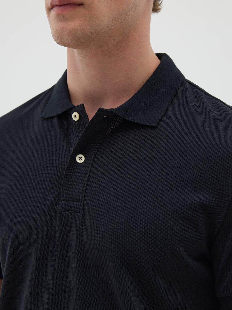 Polo da uomo in puro cotone nero regular fit_1