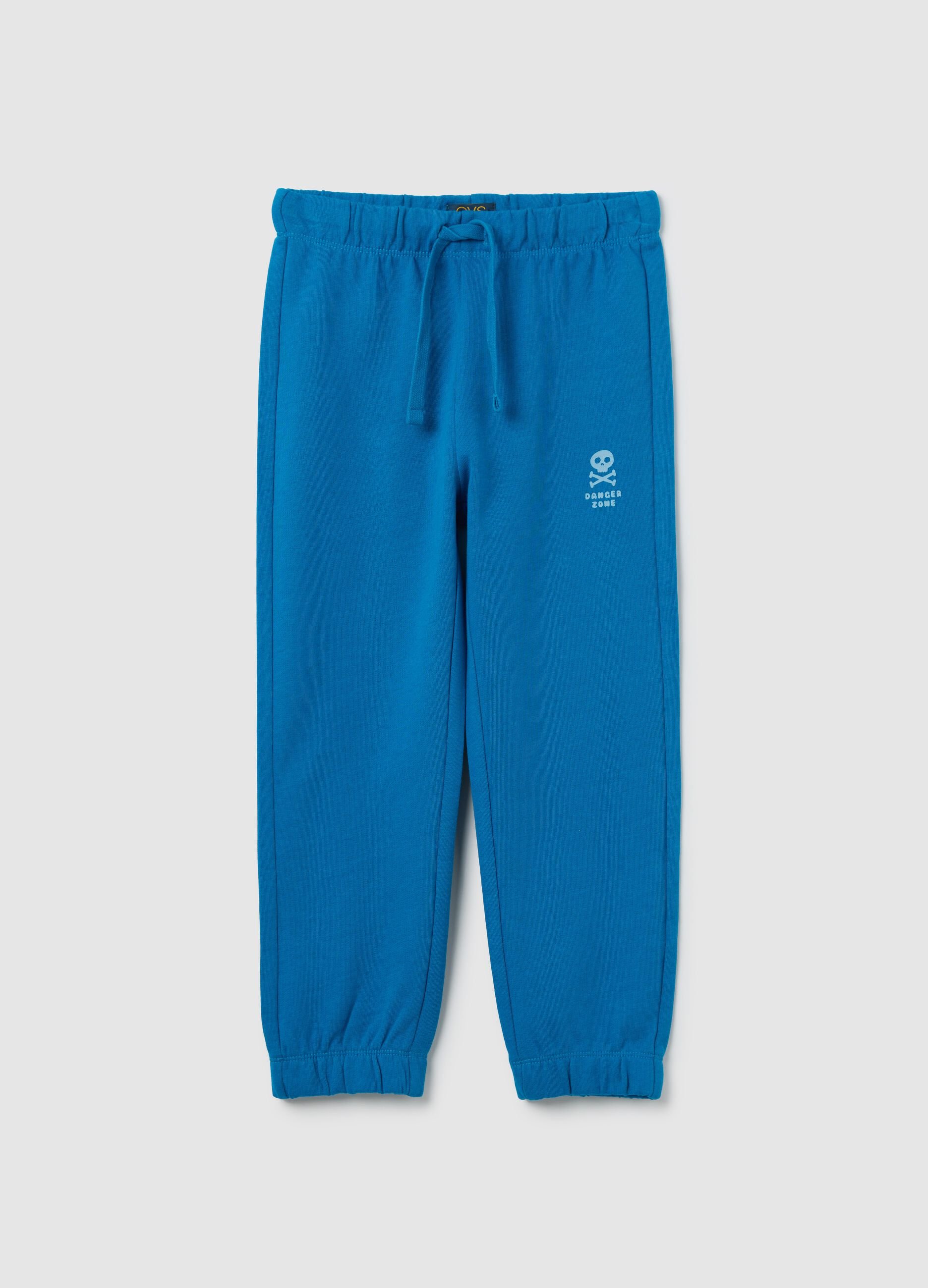 Light blue cotton joggers with drawstring and print