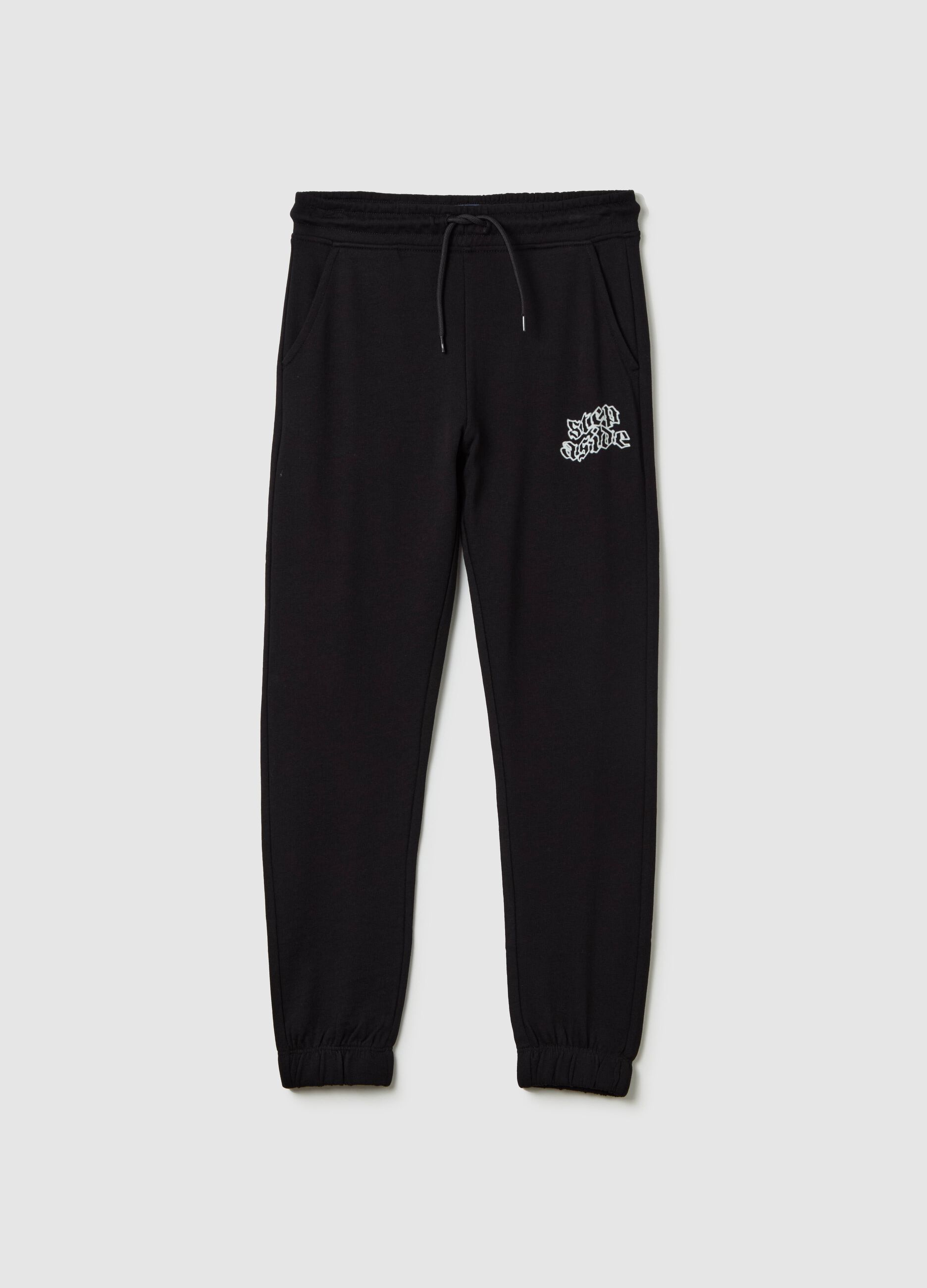 Joggers with drawstring and "Step Aside" print