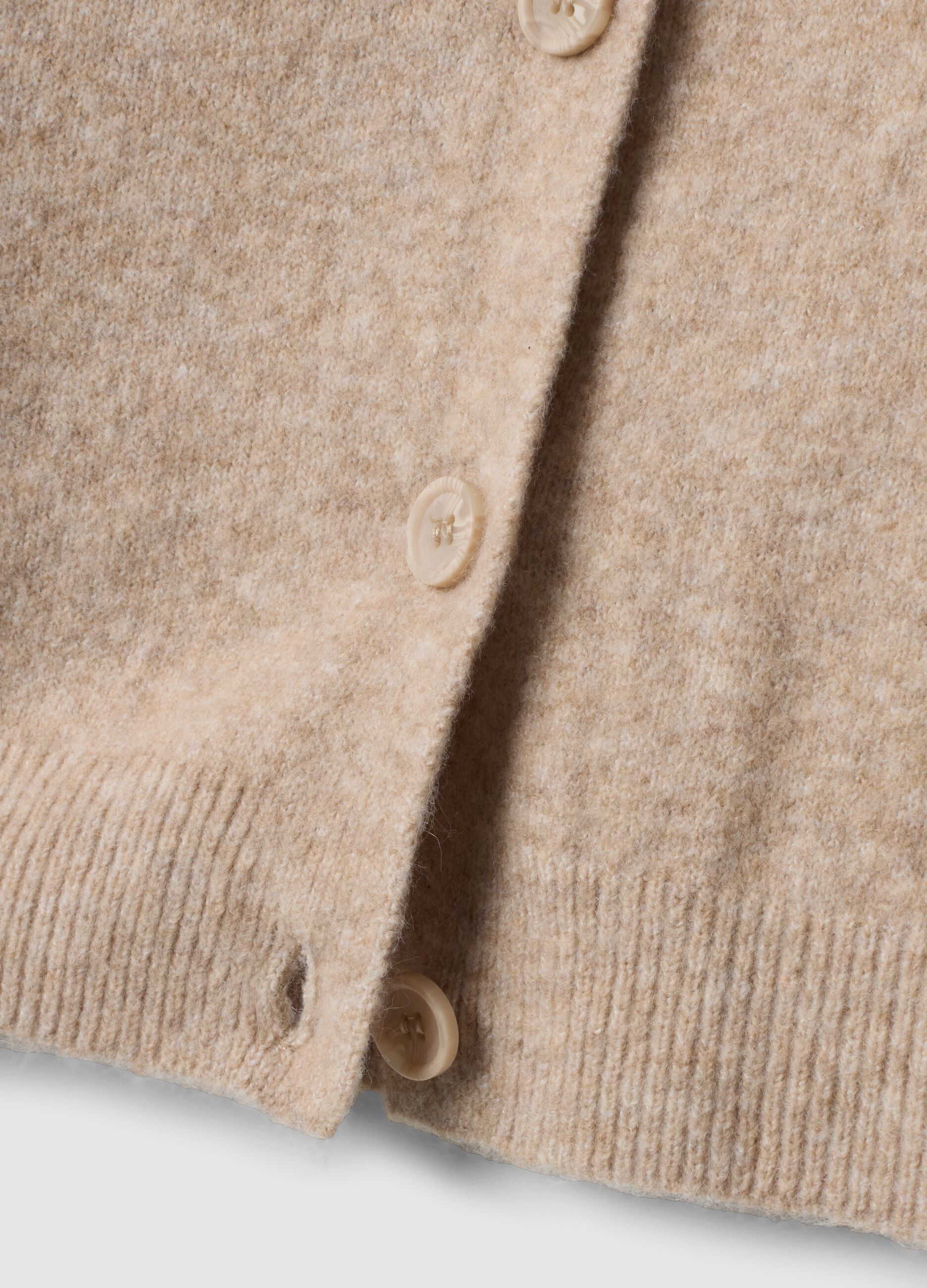 Cardigan beige in tessuto elasticizzato con girocollo over fit