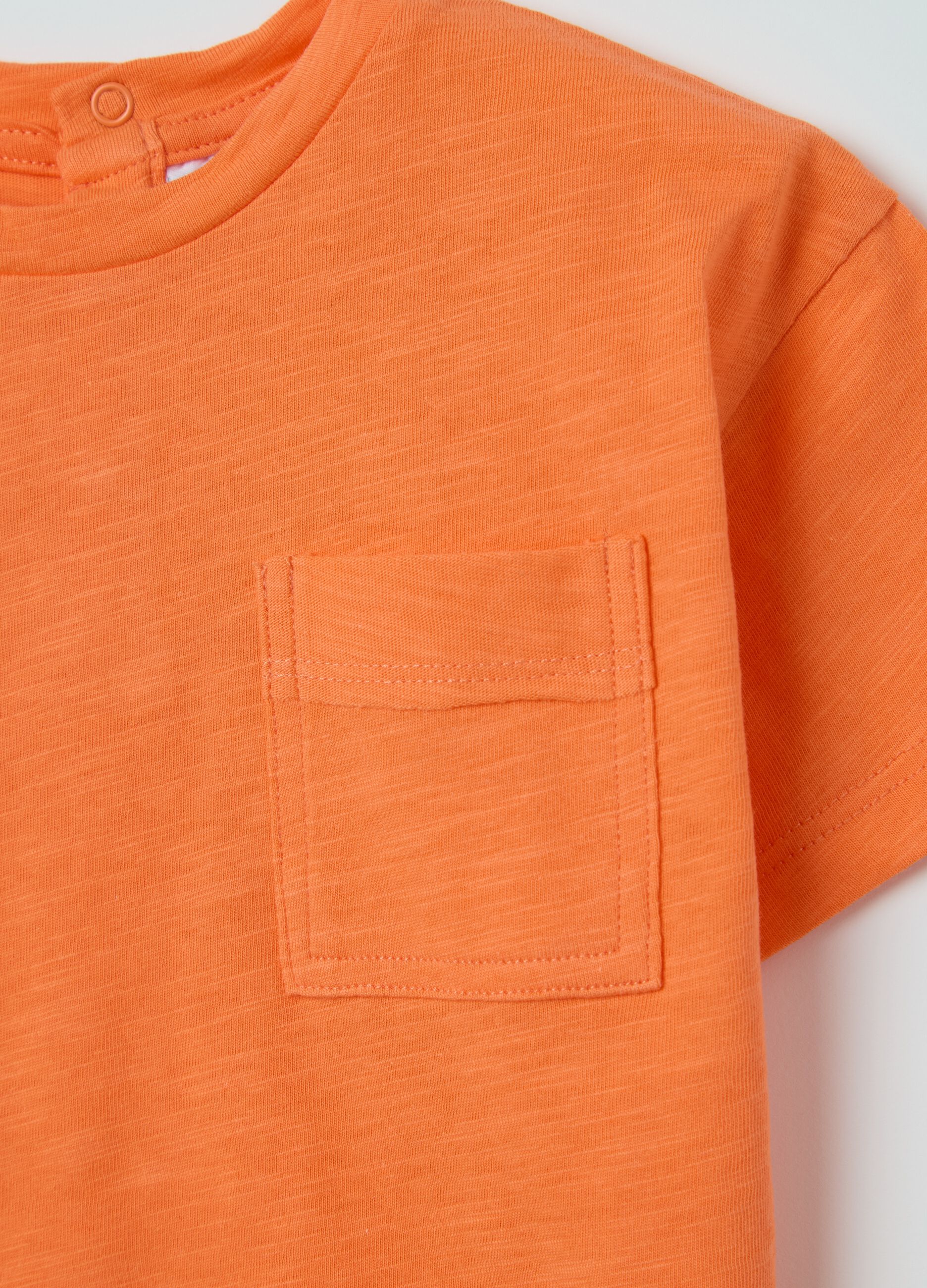 Orange T-shirt in organic cotton with pocket