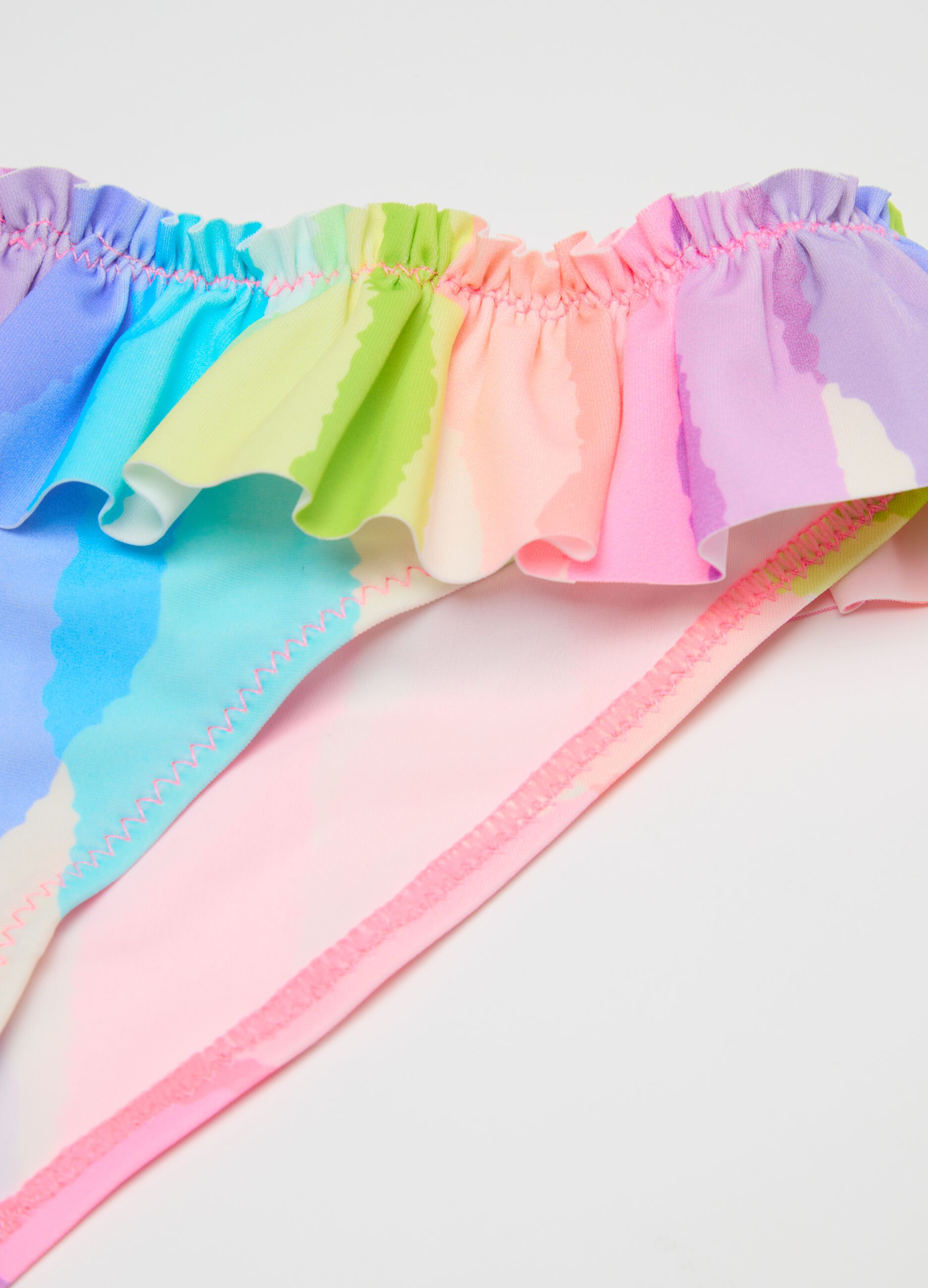Girls’ swim briefs in multicoloured stretch fabric with frill