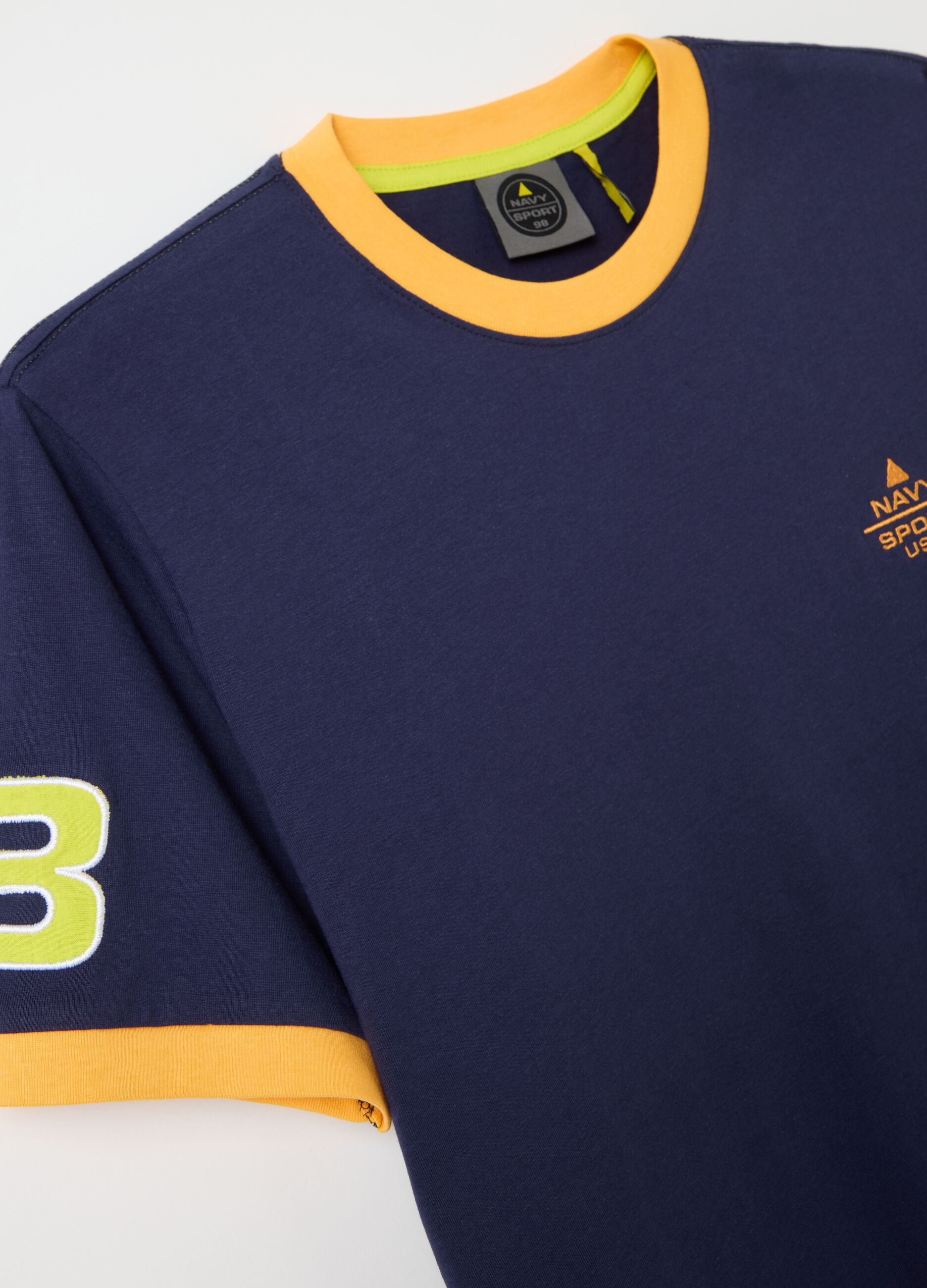 Blue T-shirt with short sleeves and orange details