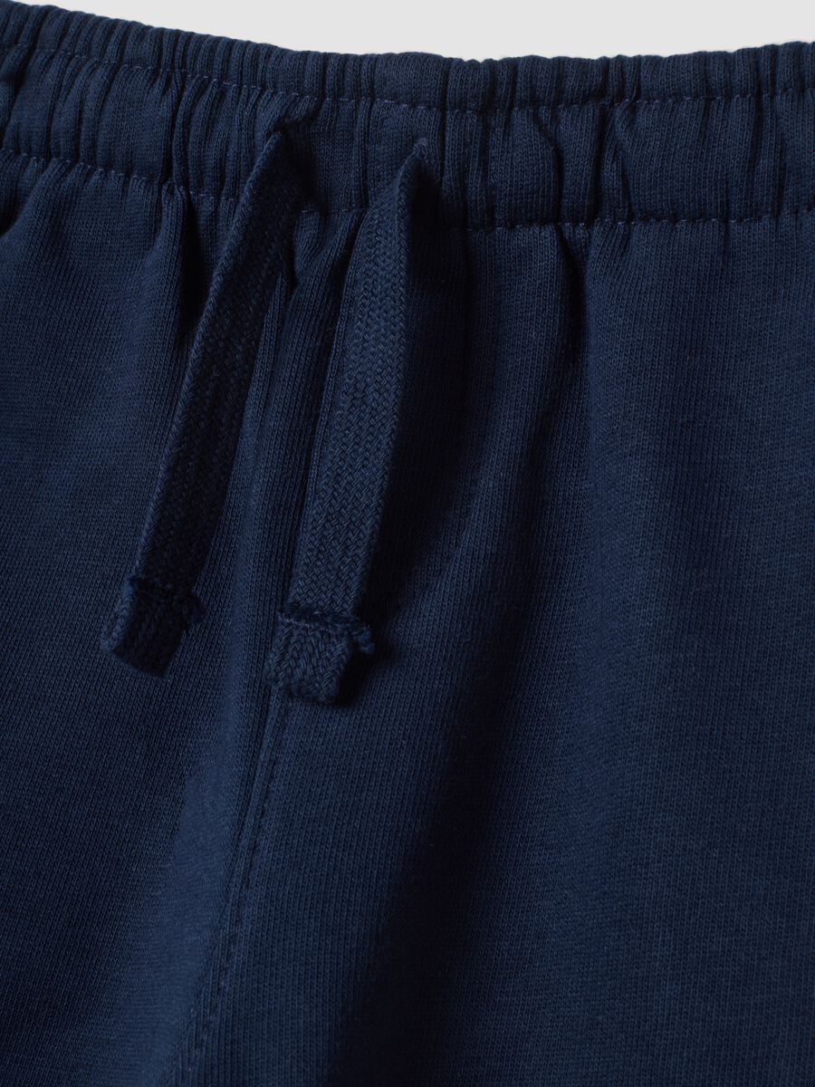Pantaloni blu in puro cotone con stampa dinosauro over fit_3