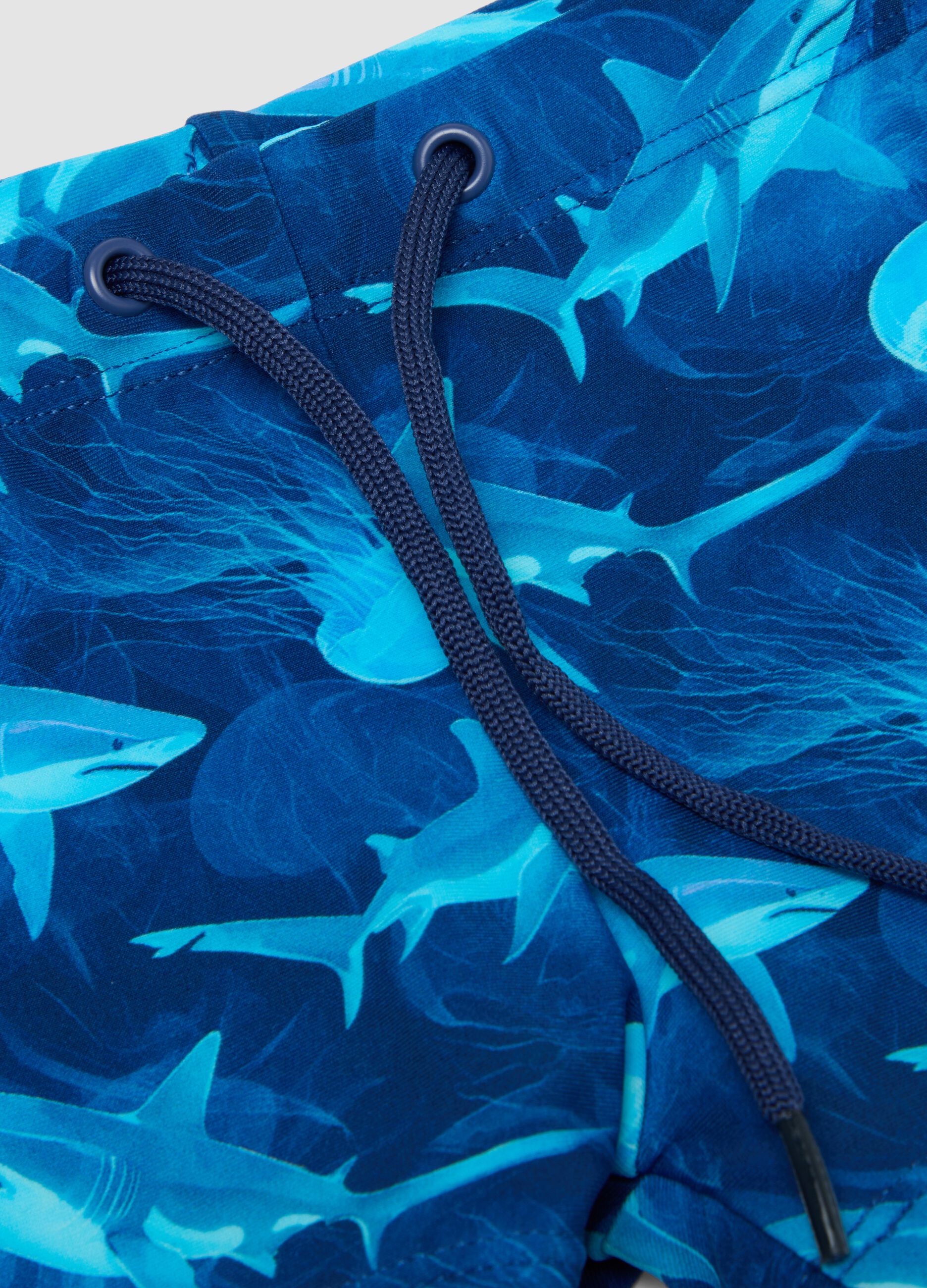 Blue stretch swim shorts with shark print