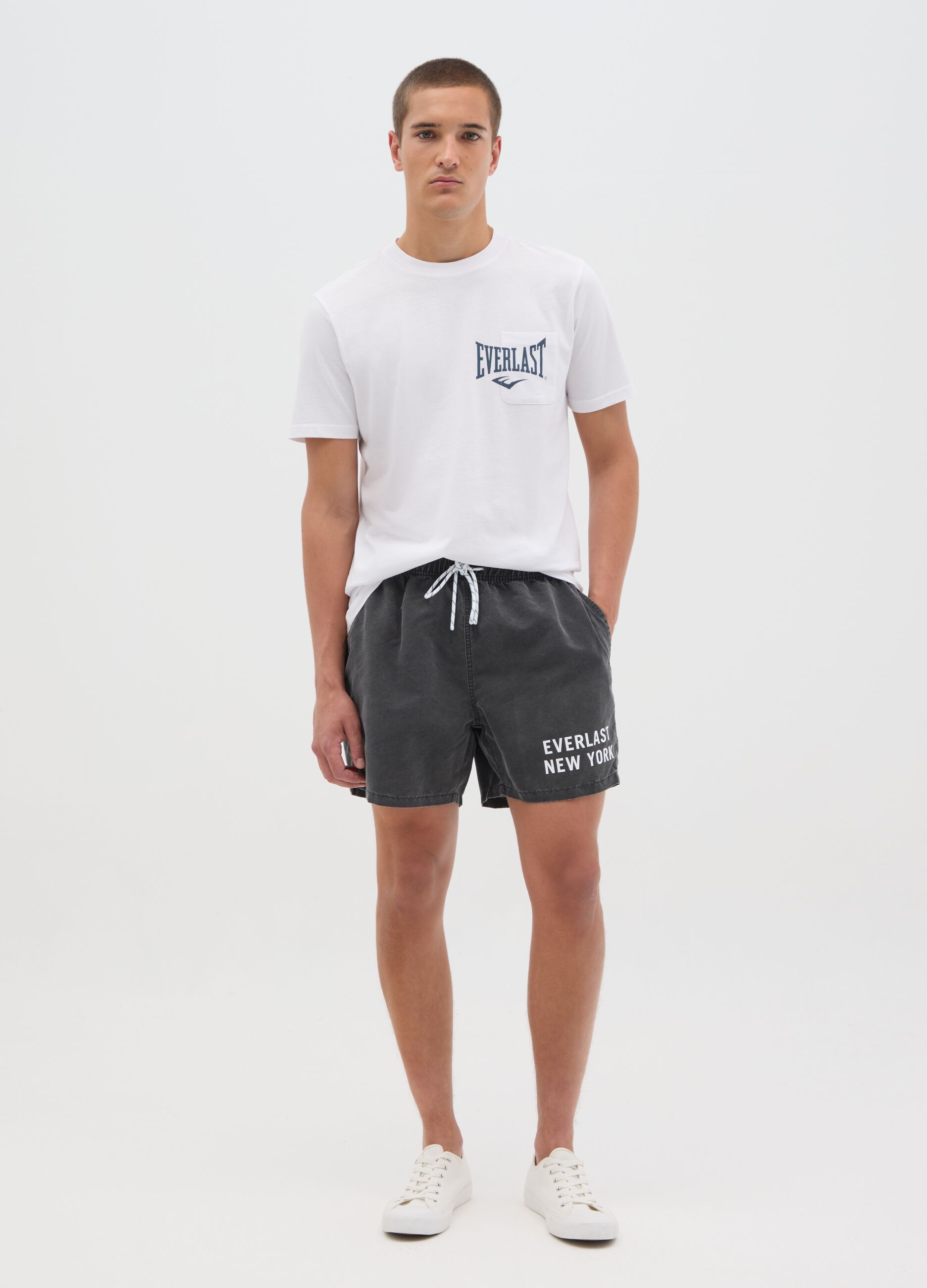Grey swimming trunks with logo print