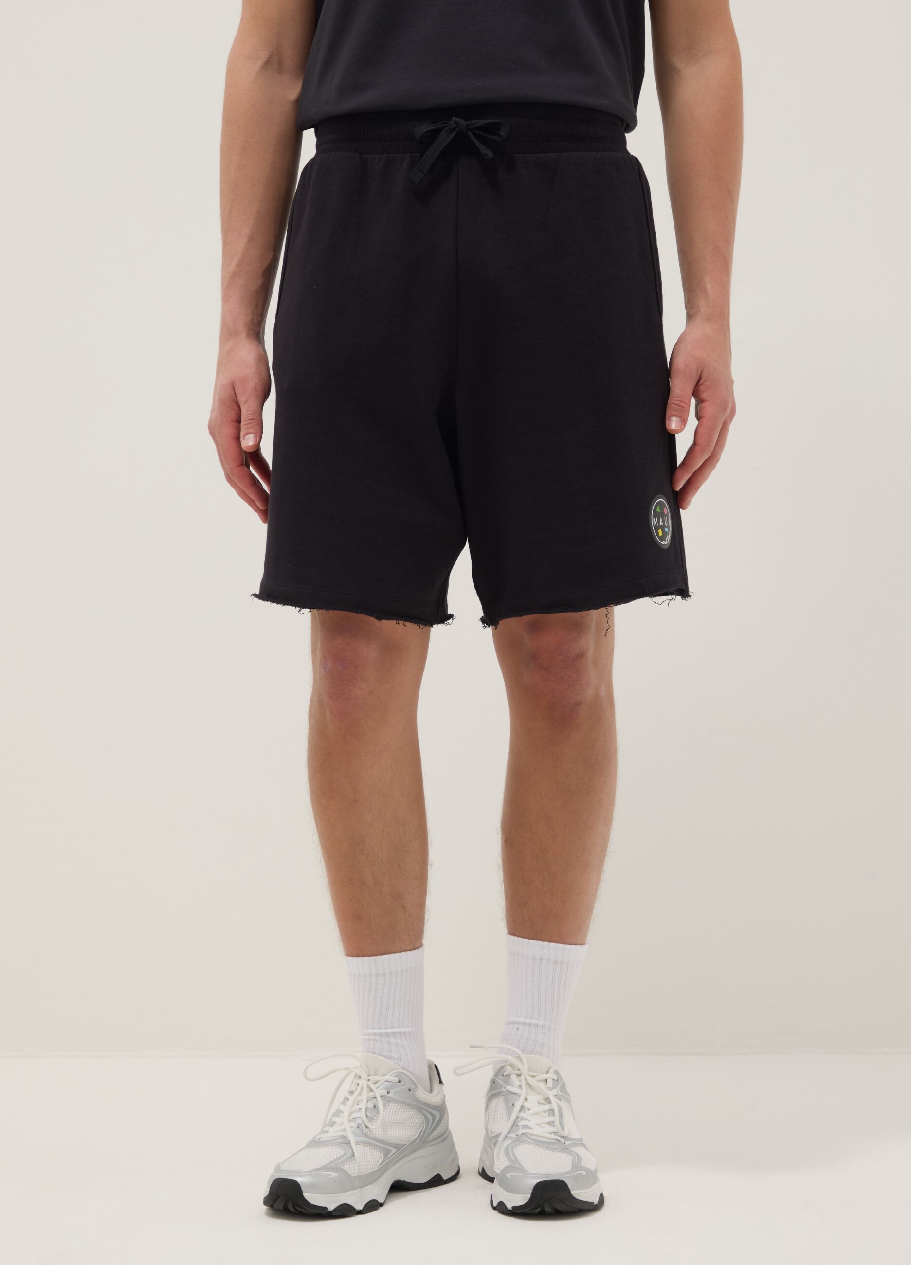 Black pure cotton relaxed-fit Bermuda shorts with raw-cut hems