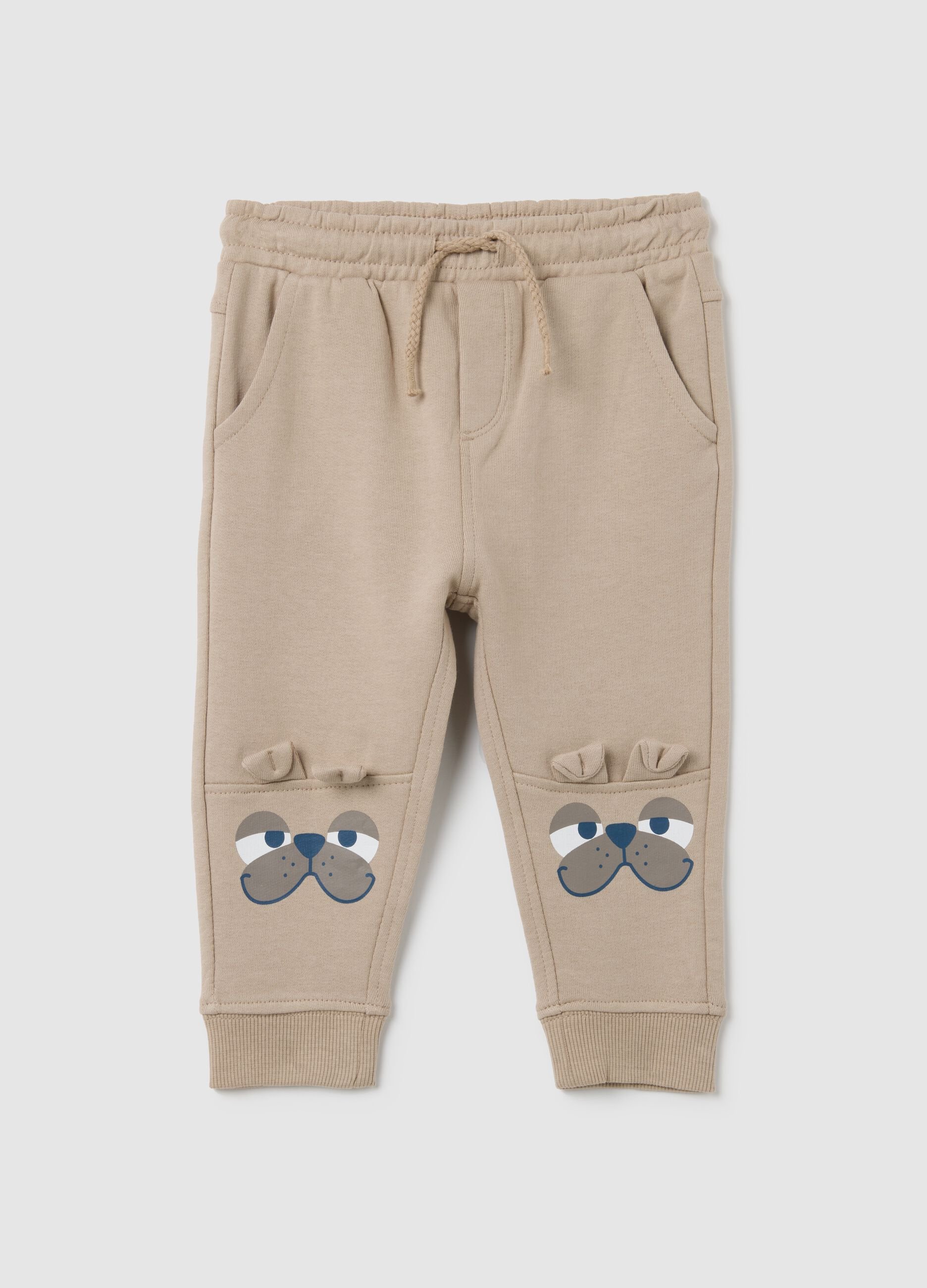 Baby trousers in pure beige cotton with dog print