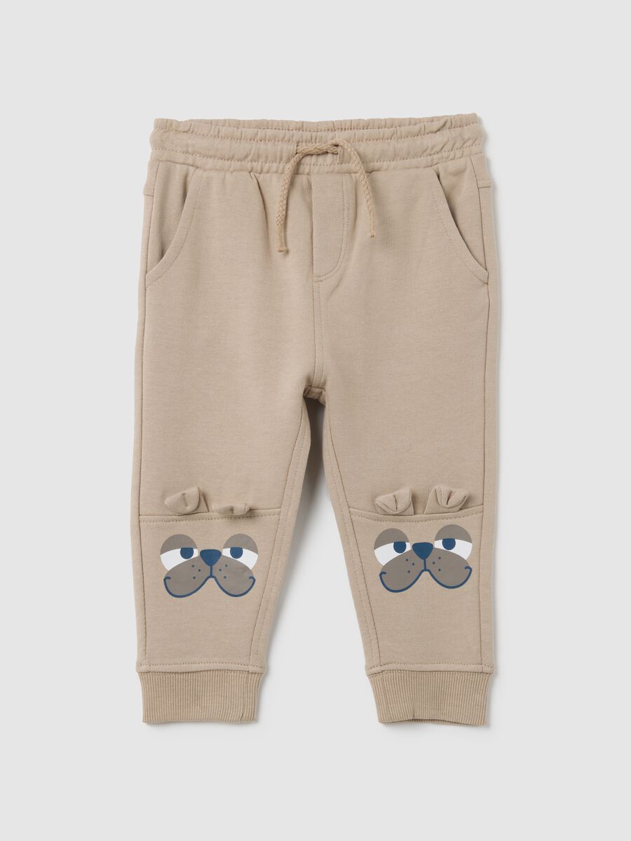 Baby trousers in pure beige cotton with dog print_0