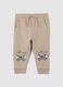 Baby trousers in pure beige cotton with dog print_0