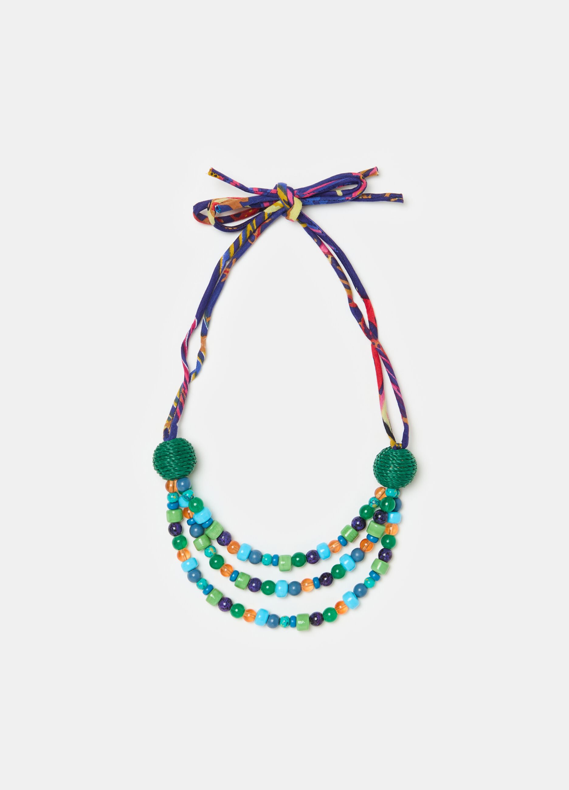 Necklace with coloured gems and laces