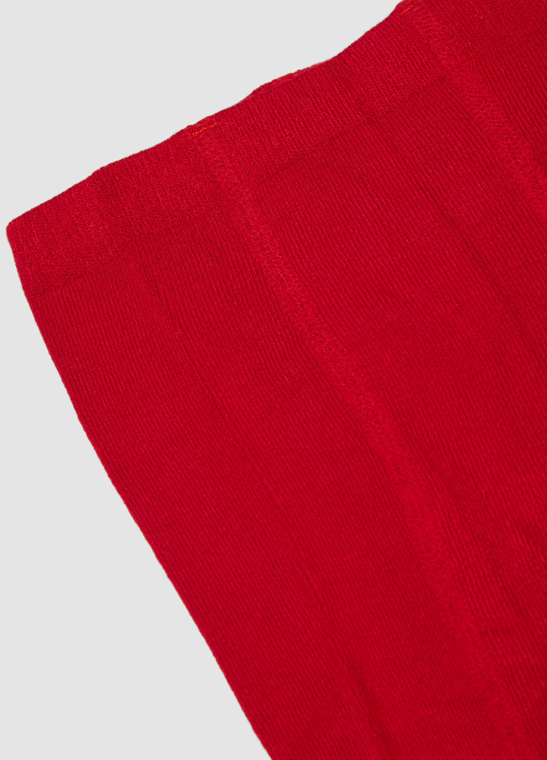Collant rosso in tessuto elasticizzato con fiocco