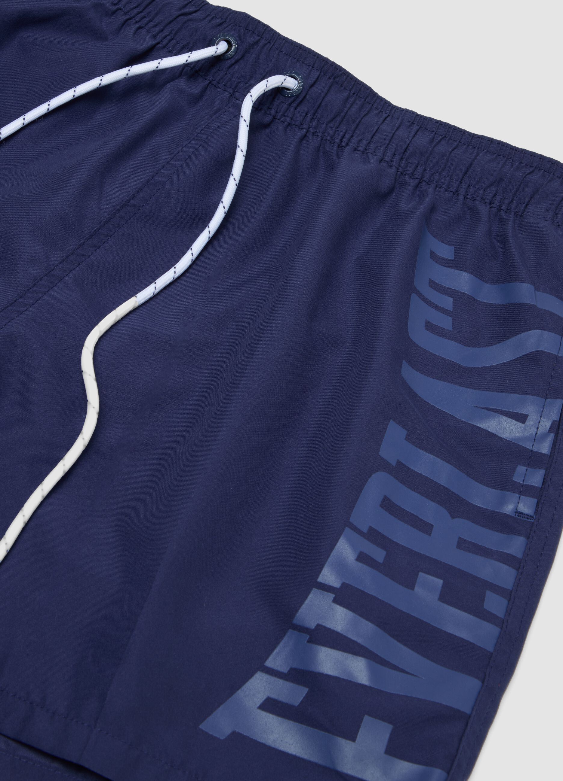 Blue swim shorts with contrast drawstring