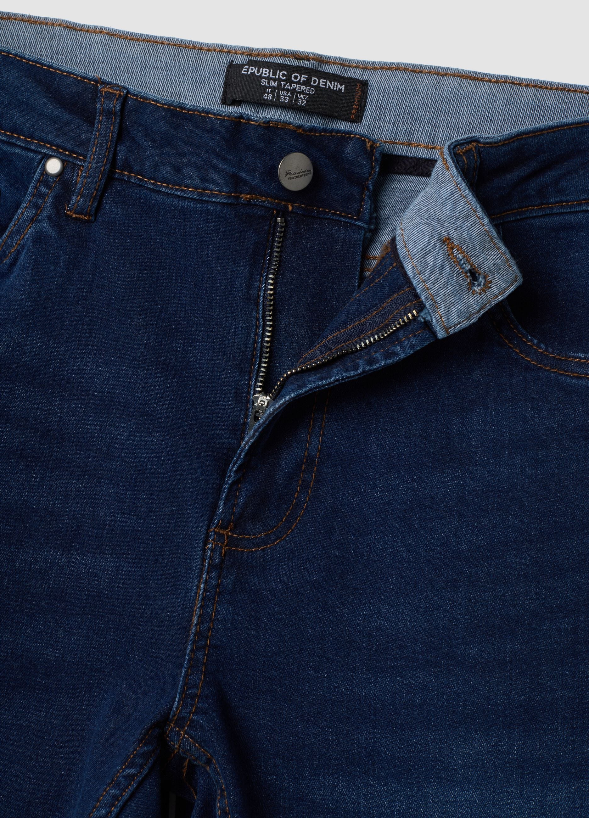 Dark blue stretch cotton slim tapered fit jeans