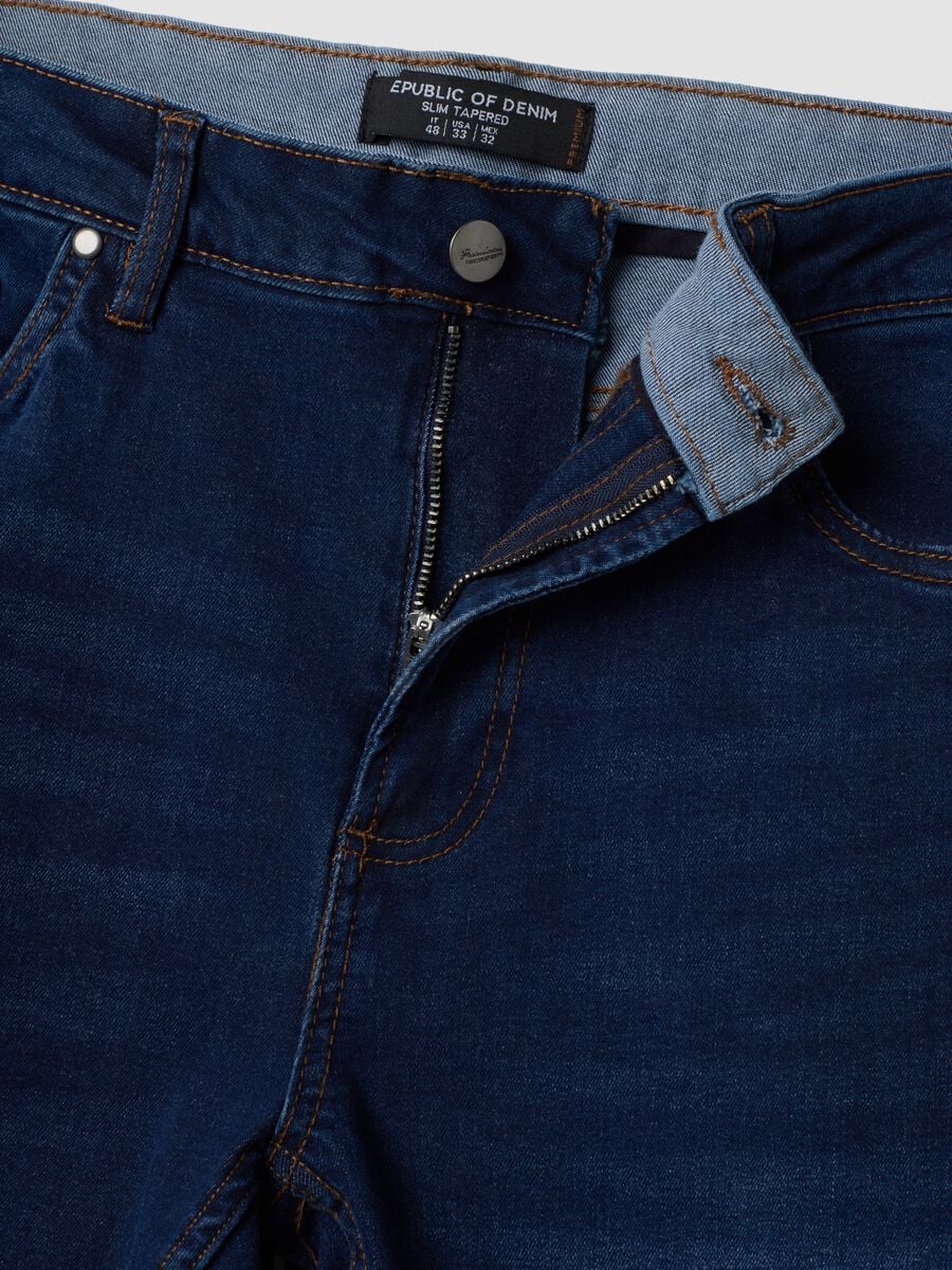 Jeans blu scuro in cotone elasticizzato slim tapered fit_1