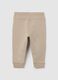 Baby trousers in pure beige cotton with dog print_1