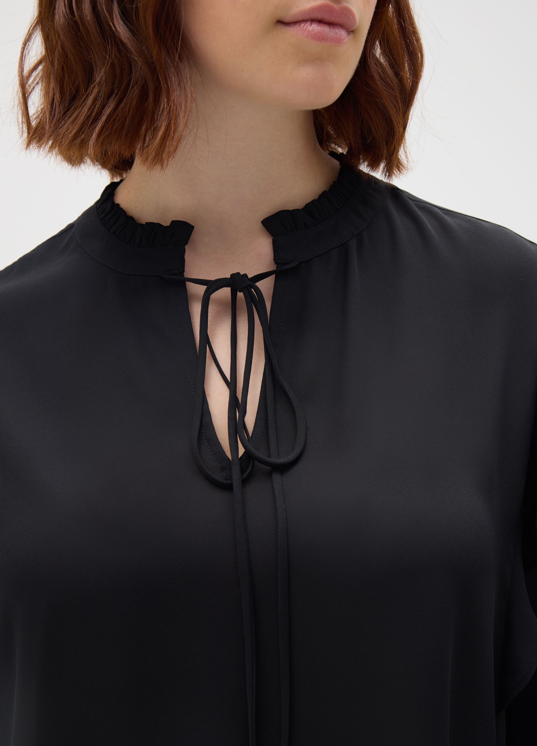 Black regular fit blouse with ruffles
