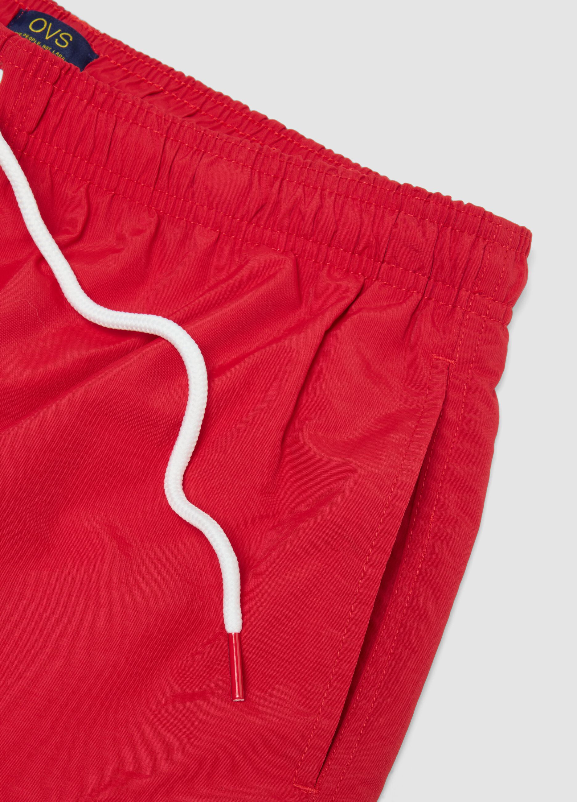 Red swim shorts with elasticated waist