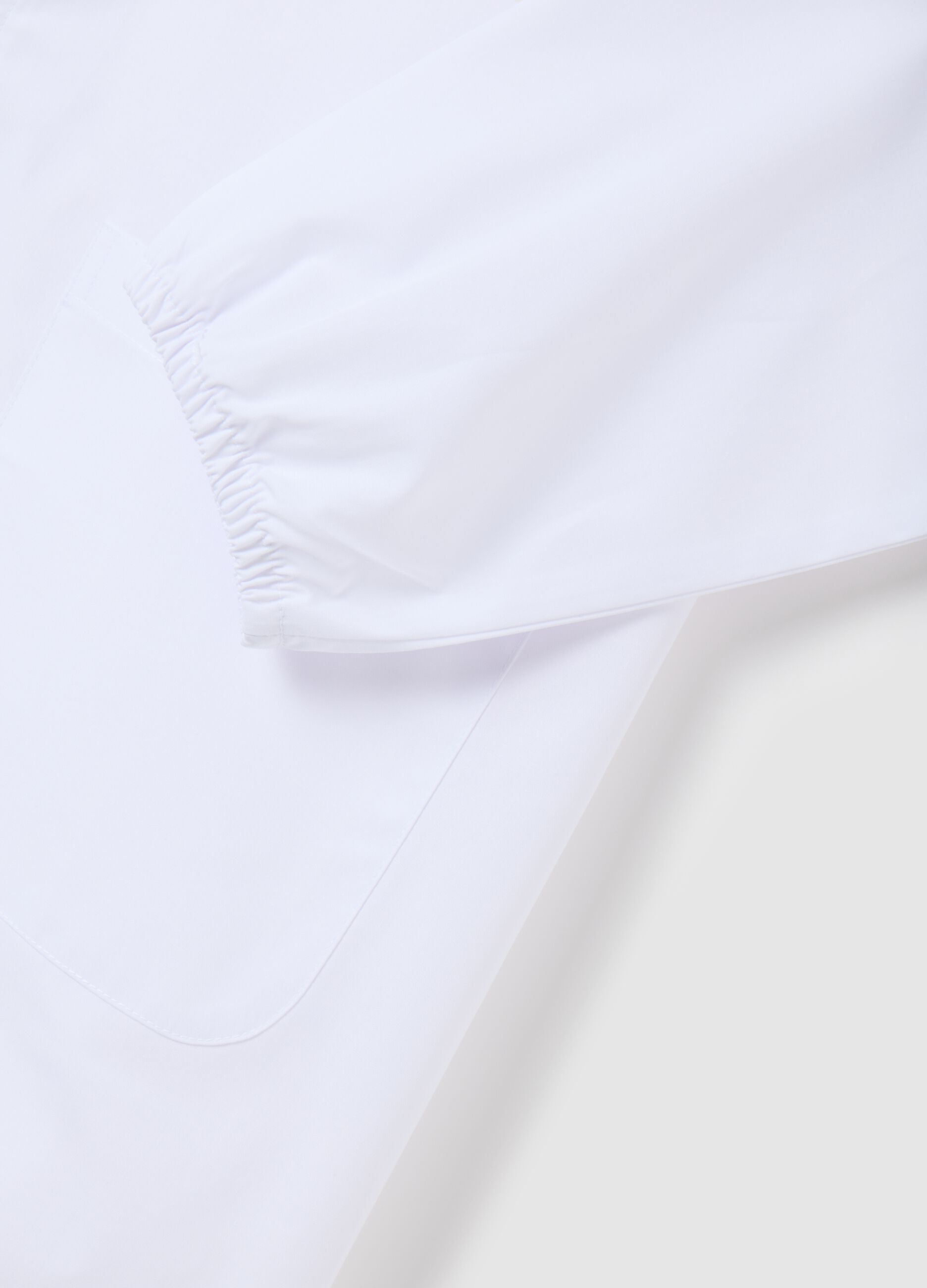 Girls' school smock in white cotton blend with Stitch embroidery